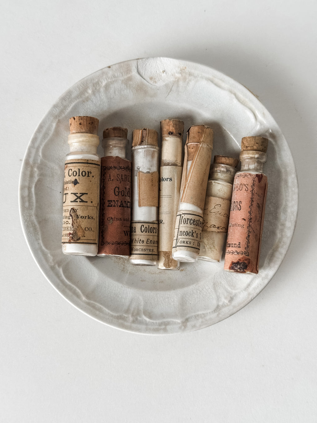 Set Of Glass Art Pigment Vials In Shades Of White With Antique Plate