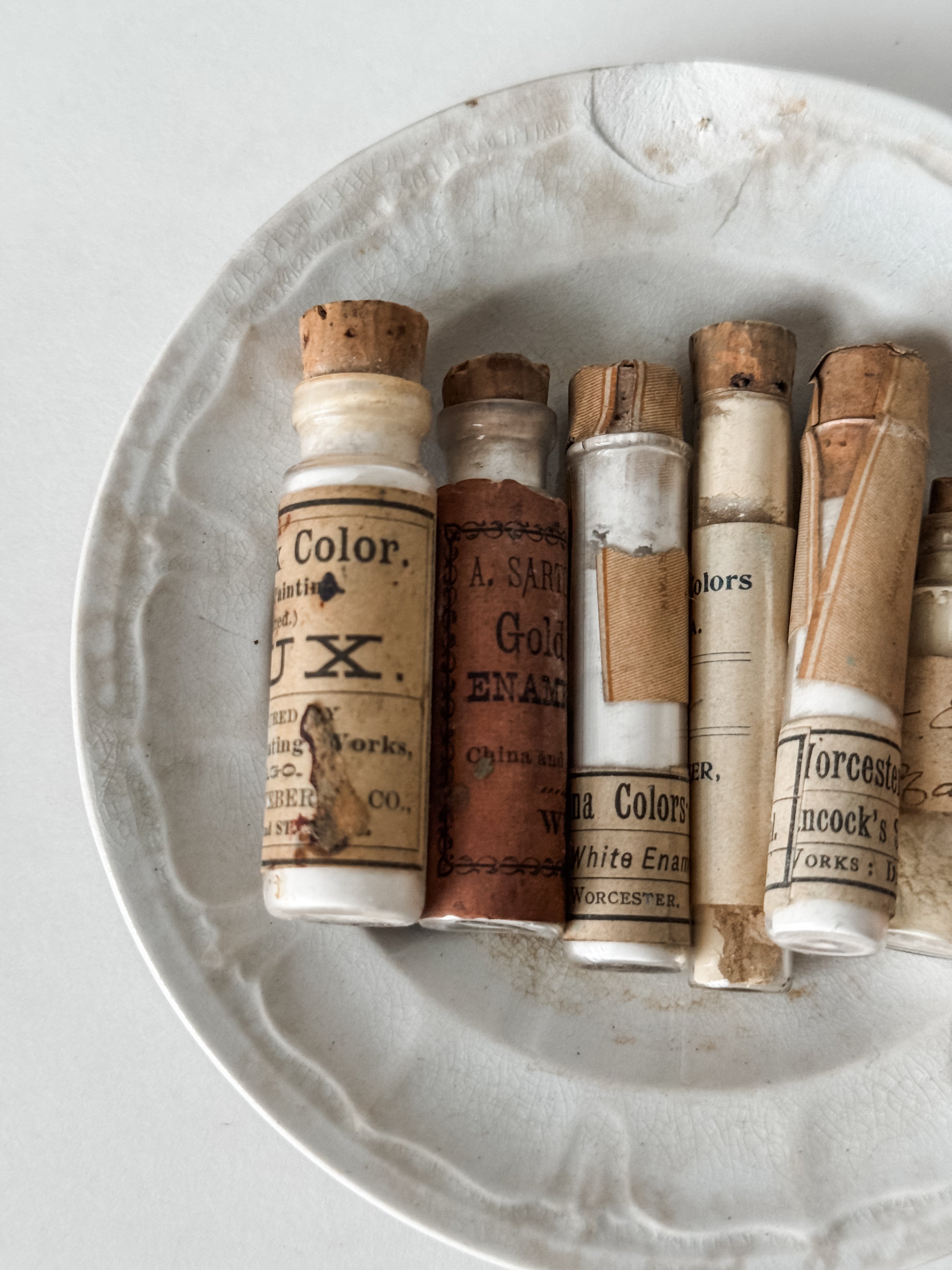 Set Of Glass Art Pigment Vials In Shades Of White With Antique Plate
