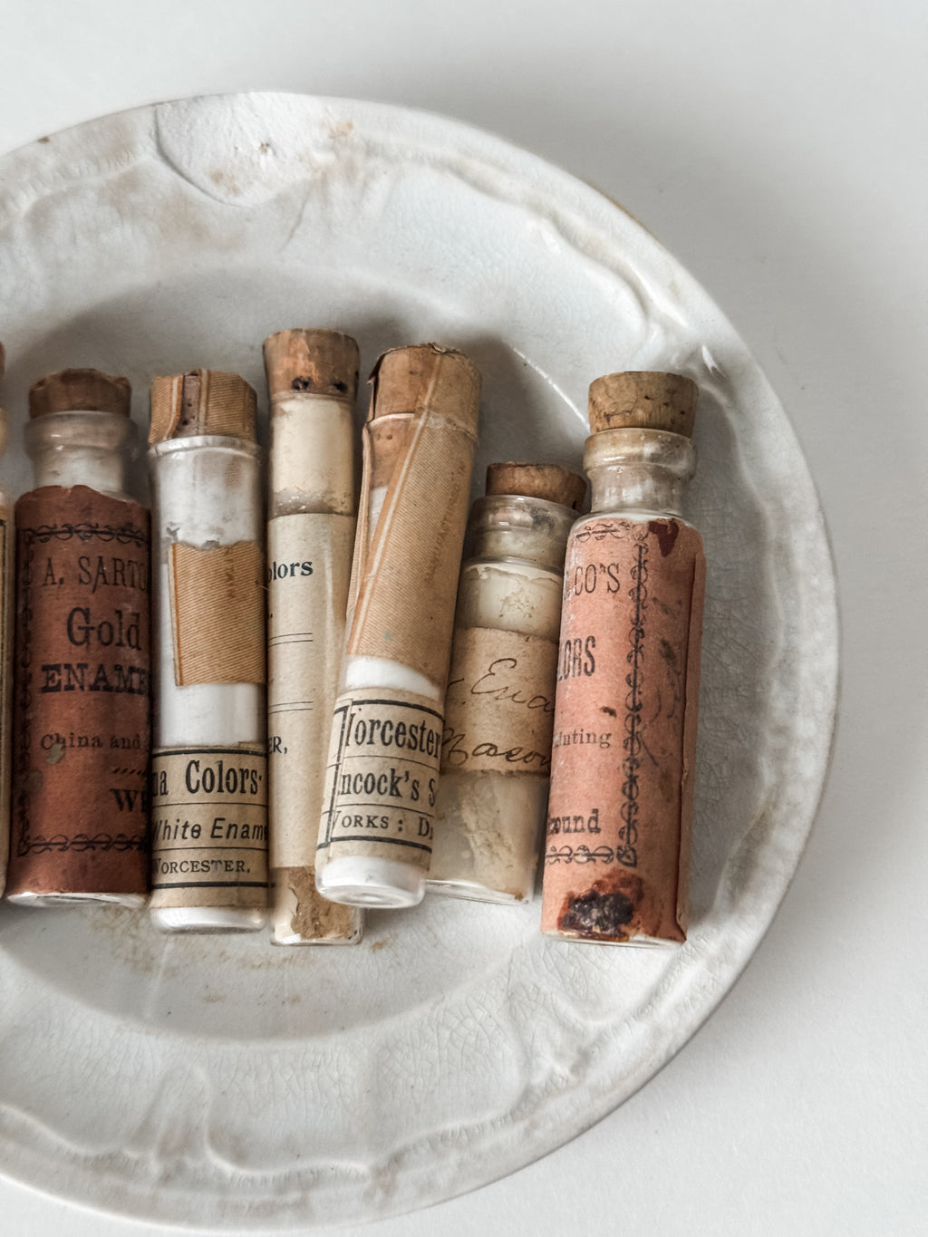 Set Of Glass Art Pigment Vials In Shades Of White With Antique Plate