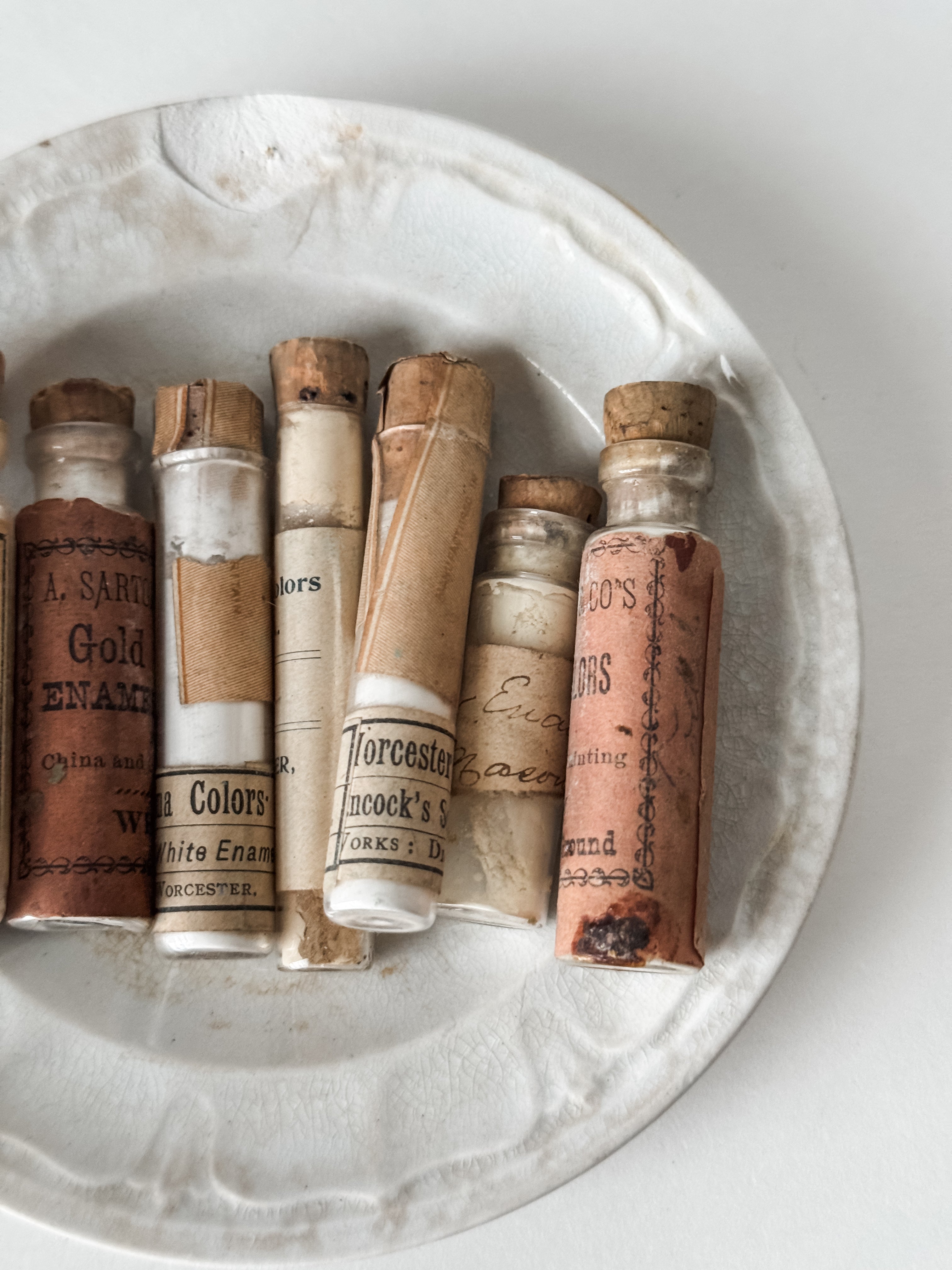 Set Of Glass Art Pigment Vials In Shades Of White With Antique Plate