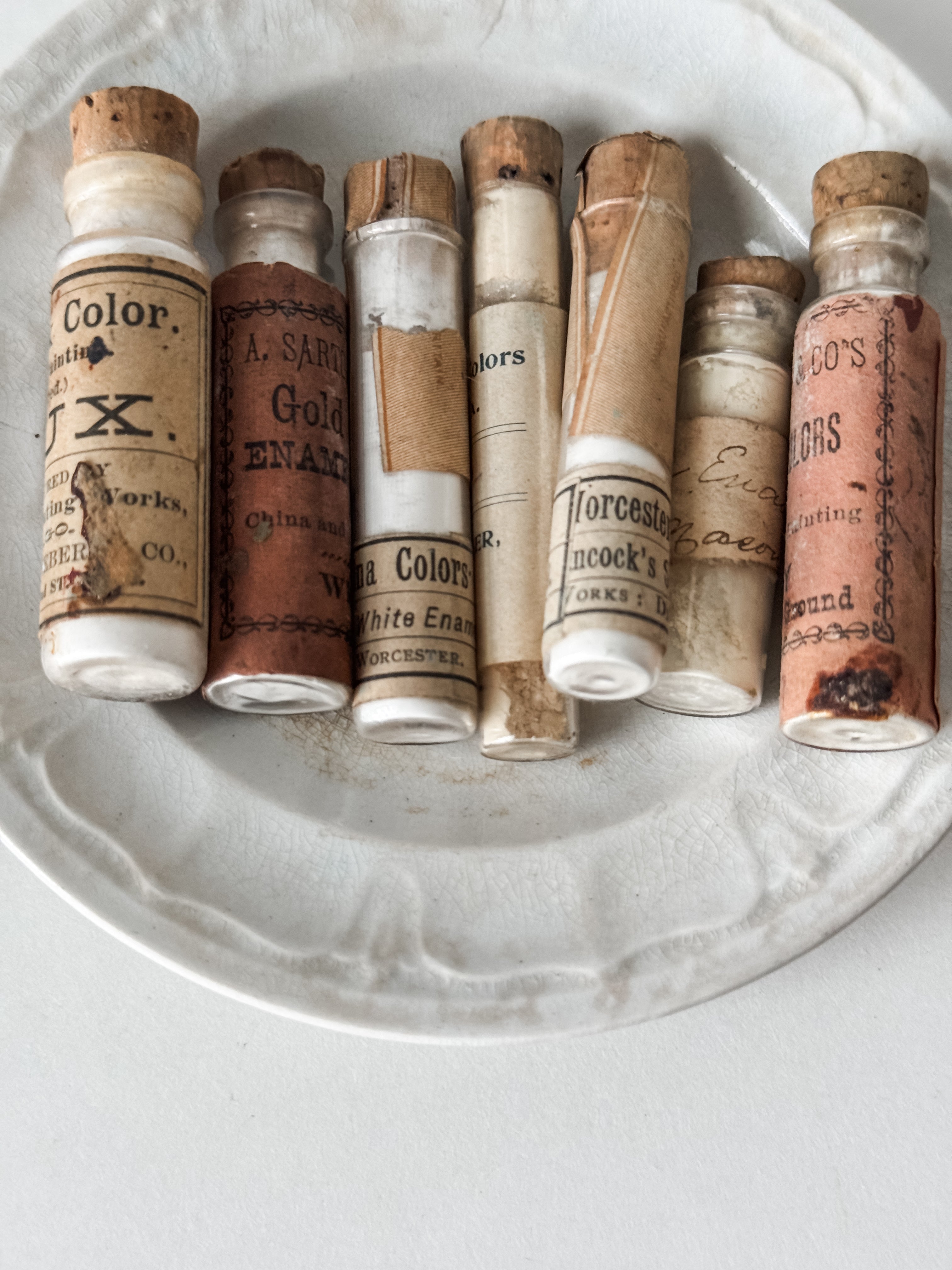 Set Of Glass Art Pigment Vials In Shades Of White With Antique Plate