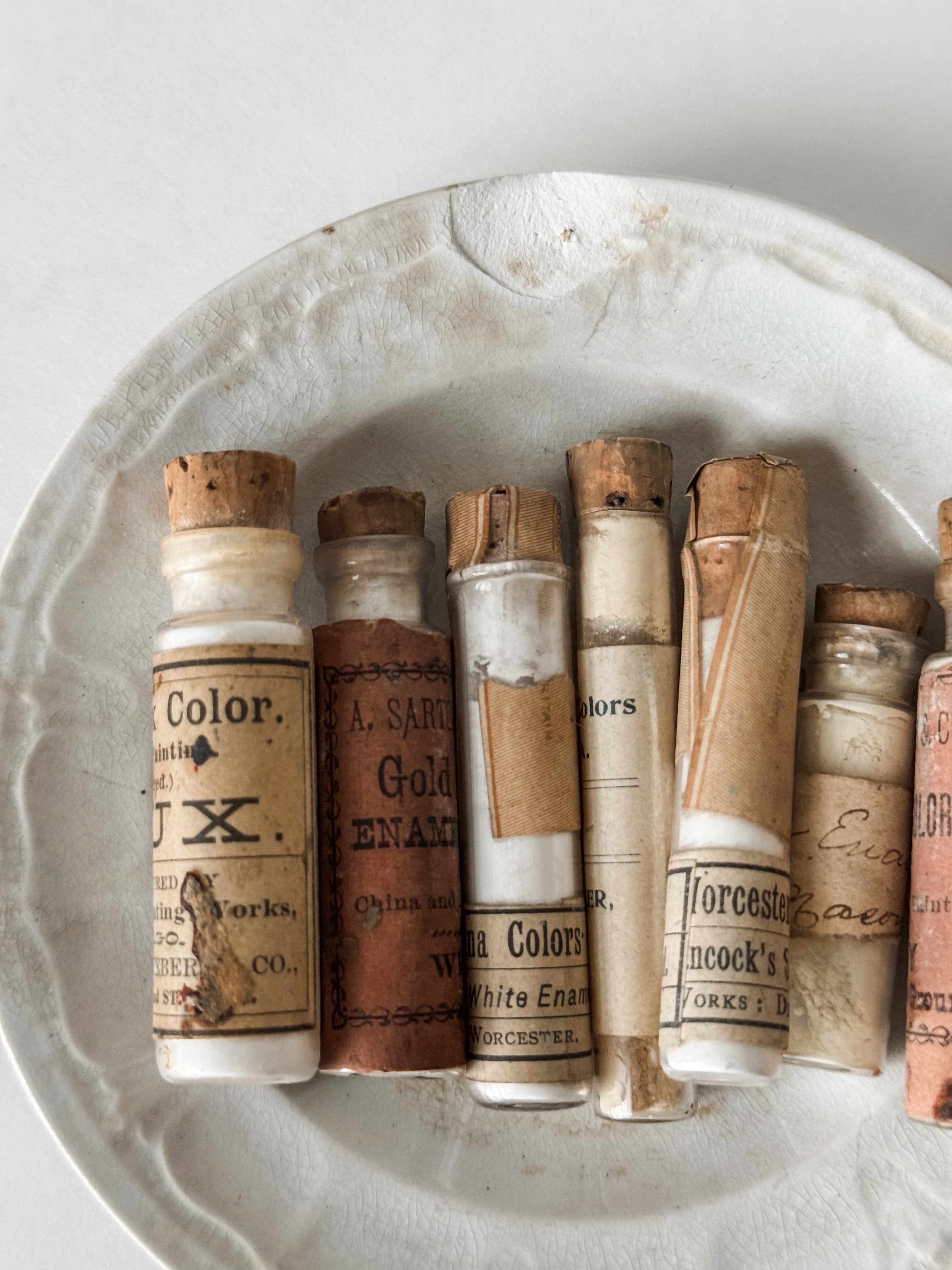 Set Of Glass Art Pigment Vials In Shades Of White With Antique Plate
