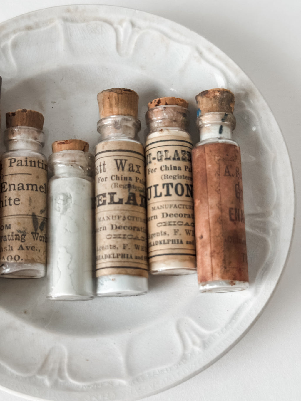 Set Of Glass Art Pigment Vials In Shades Of White With Antique Plate