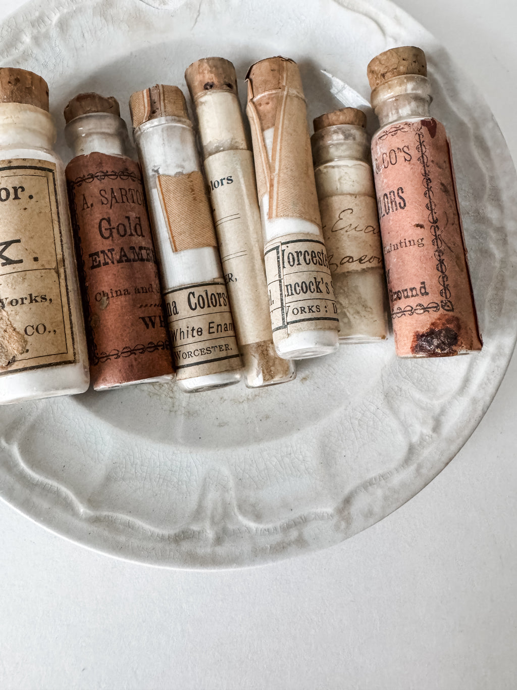 Set Of Glass Art Pigment Vials In Shades Of White With Antique Plate