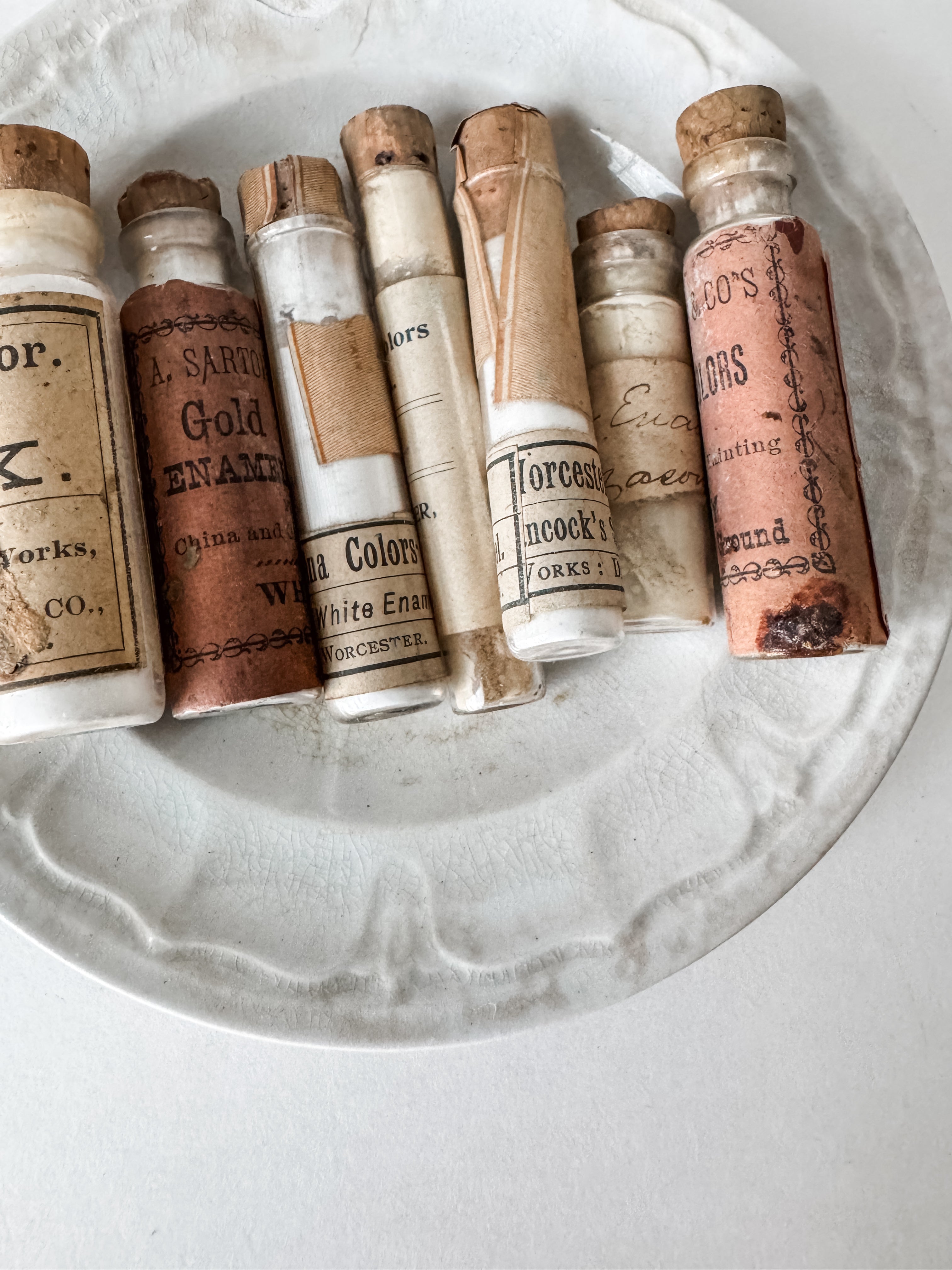 Set Of Glass Art Pigment Vials In Shades Of White With Antique Plate