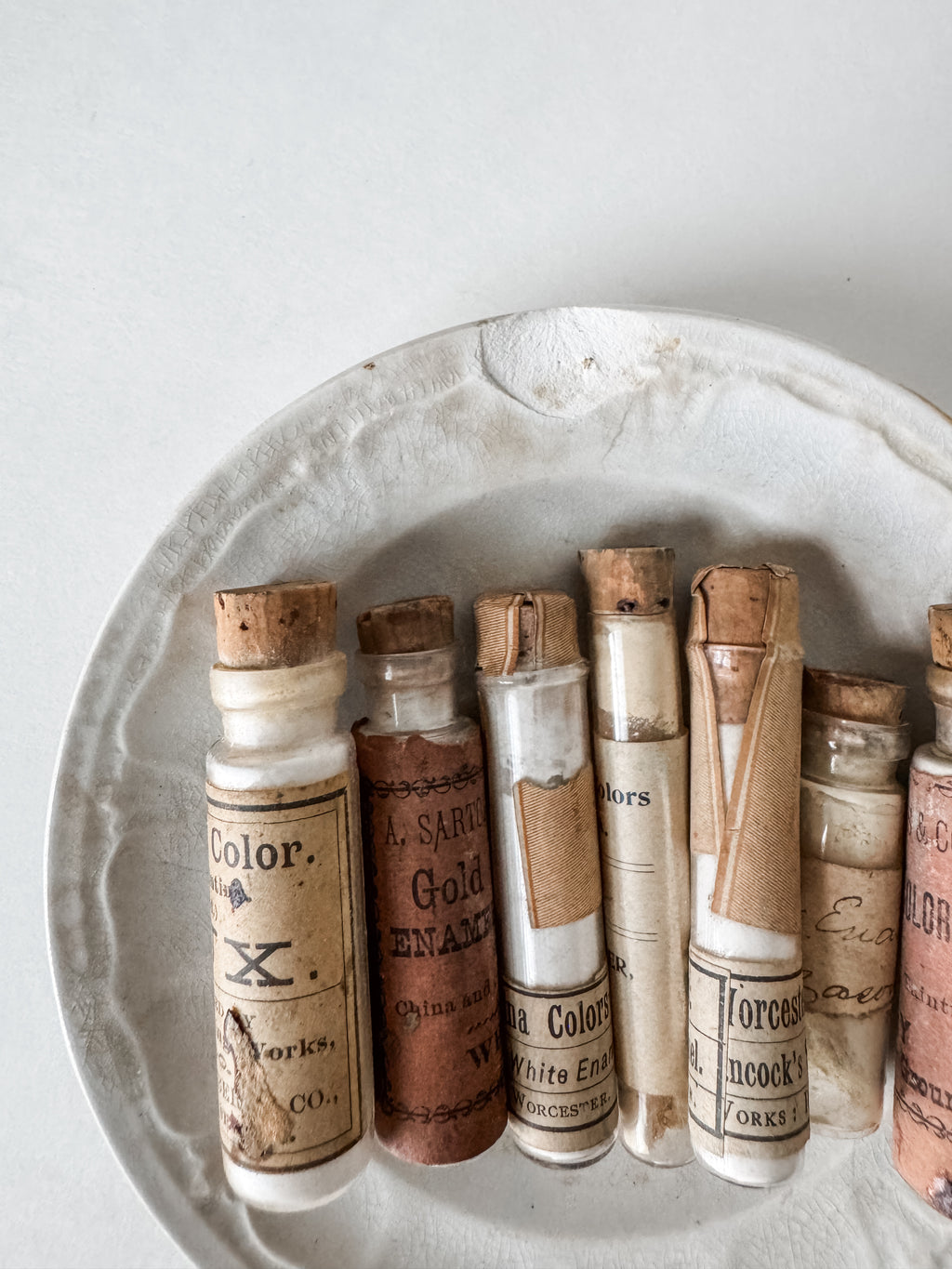 Set Of Glass Art Pigment Vials In Shades Of White With Antique Plate