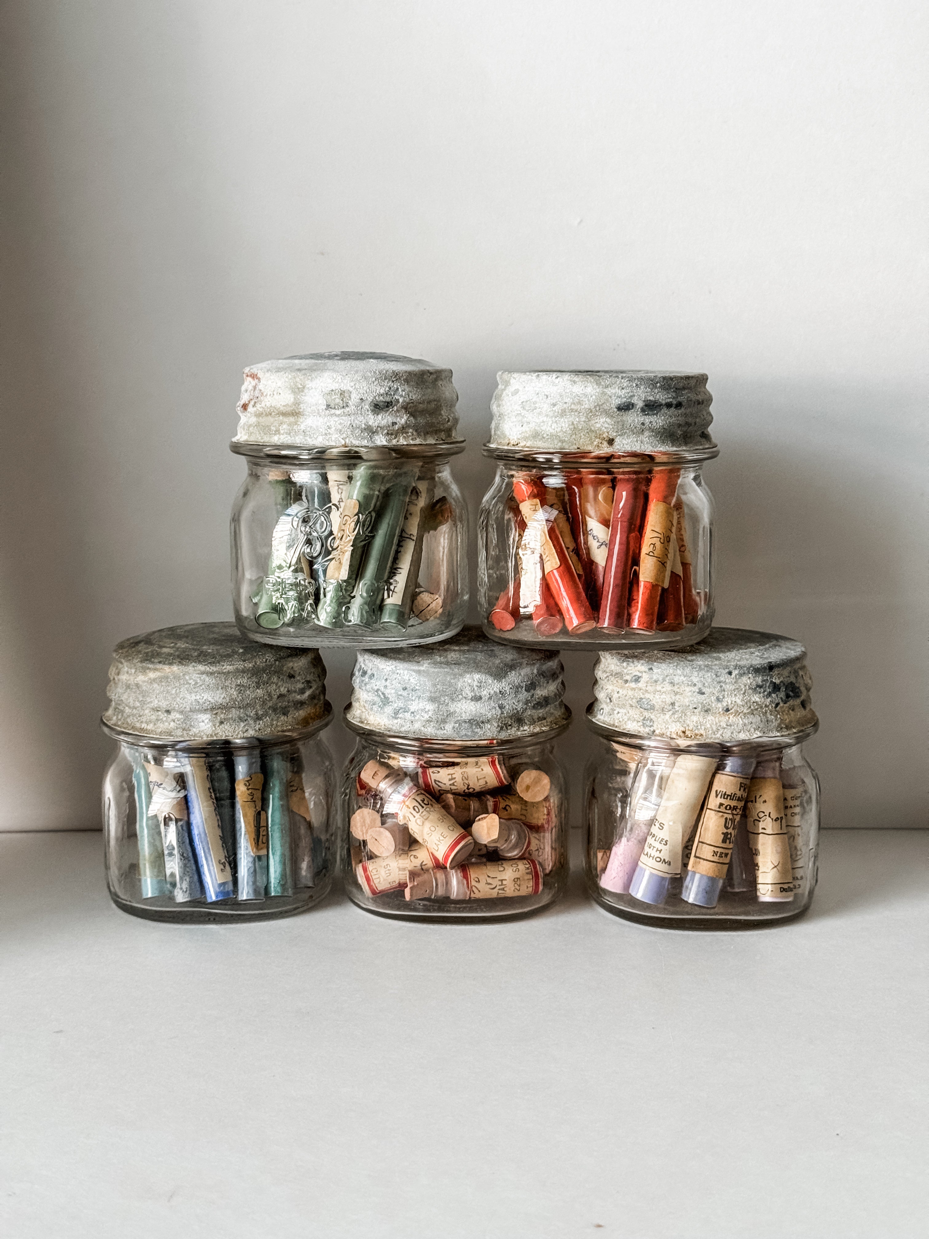 Glass Vials Of Vintage And Antique Paint Powder Pigments In A Vintage Jar With Zinc Lid