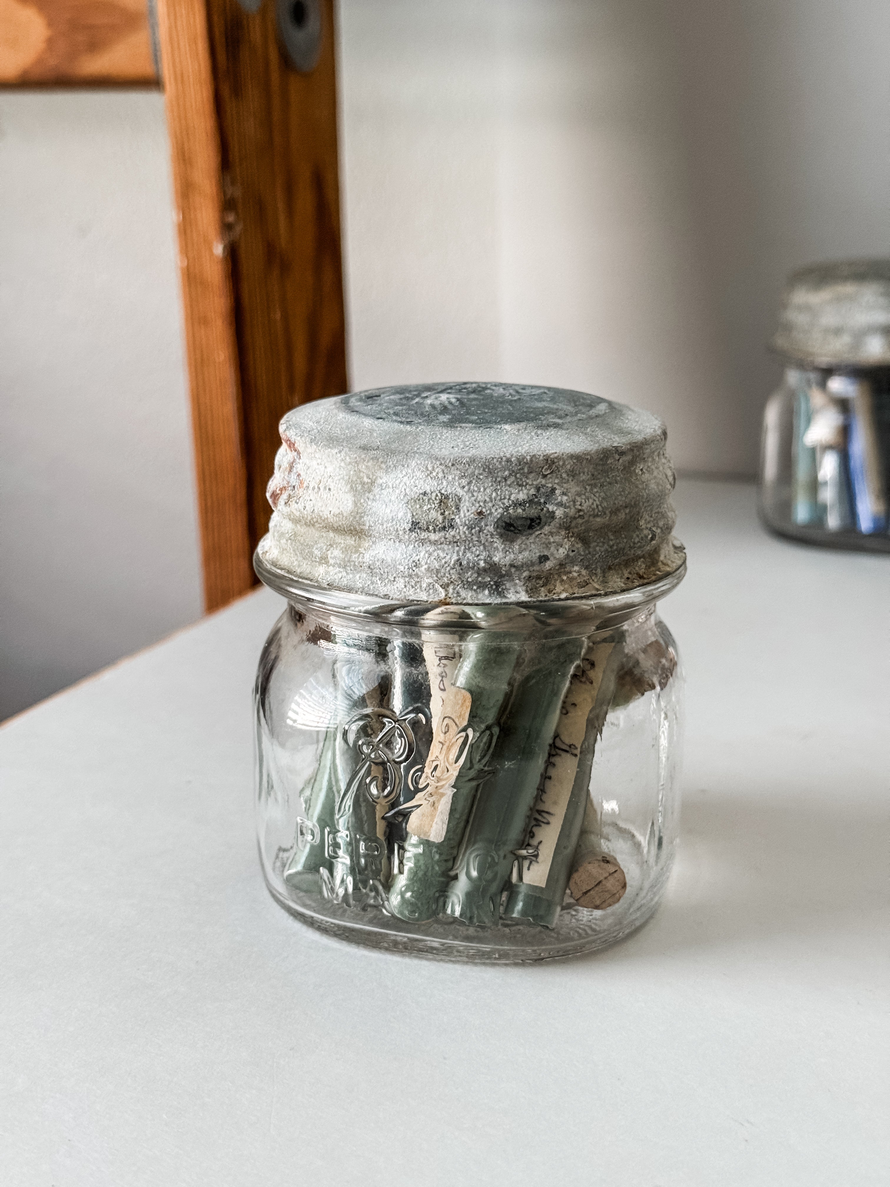 Glass Vials Of Vintage And Antique Paint Powder Pigments In A Vintage Jar With Zinc Lid