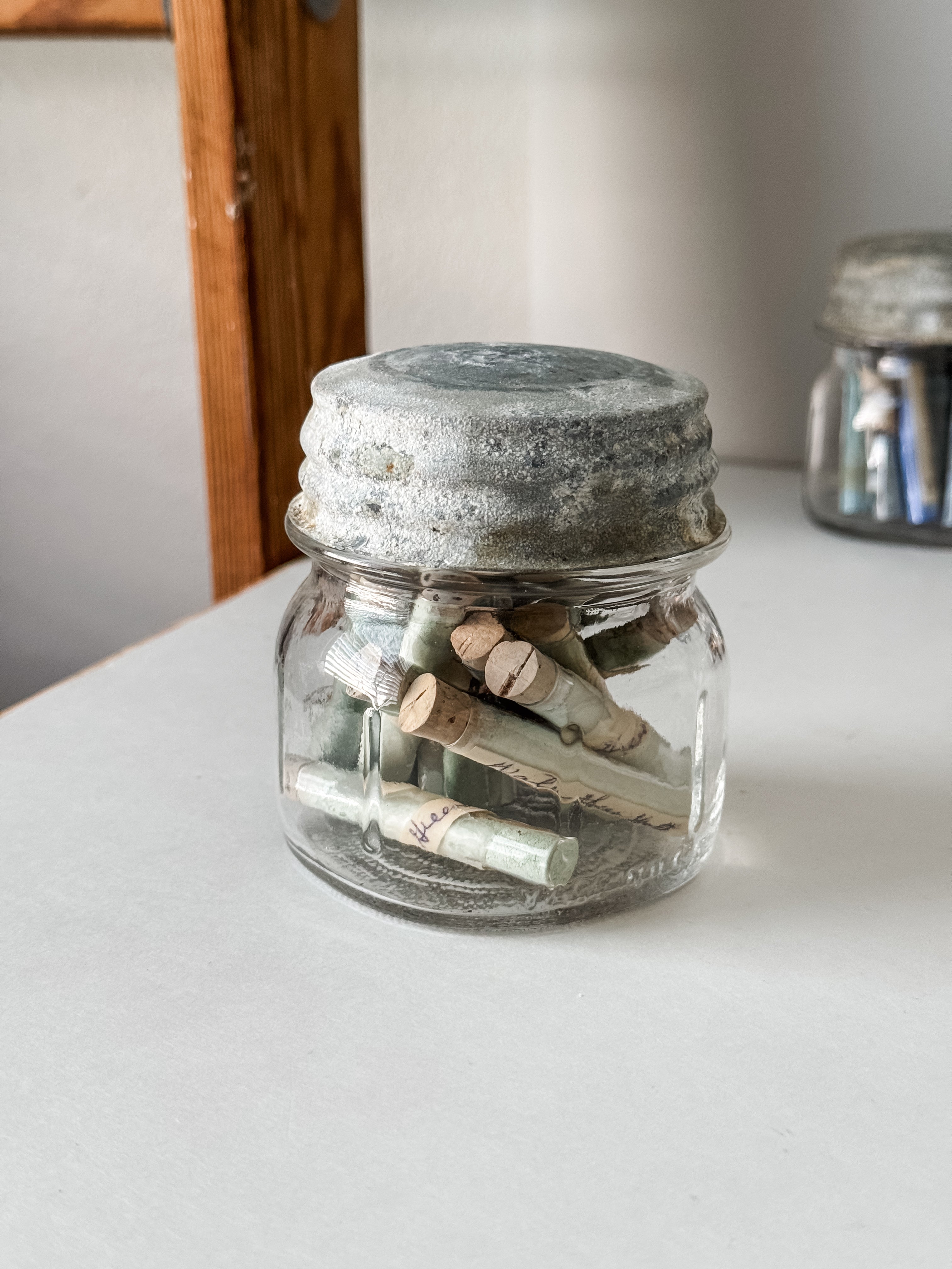 Glass Vials Of Vintage And Antique Paint Powder Pigments In A Vintage Jar With Zinc Lid