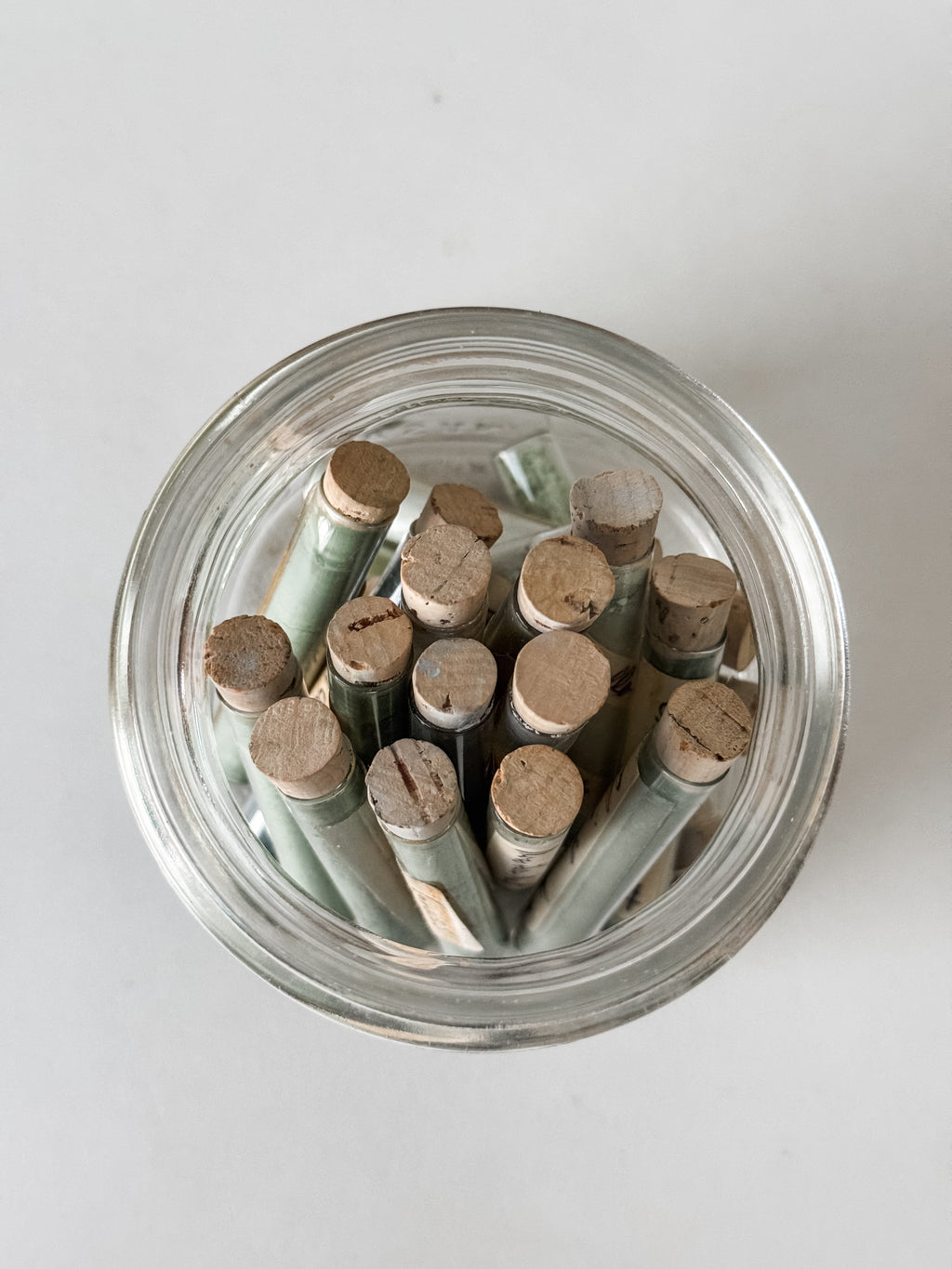 Glass Vials Of Vintage And Antique Paint Powder Pigments In A Vintage Jar With Zinc Lid
