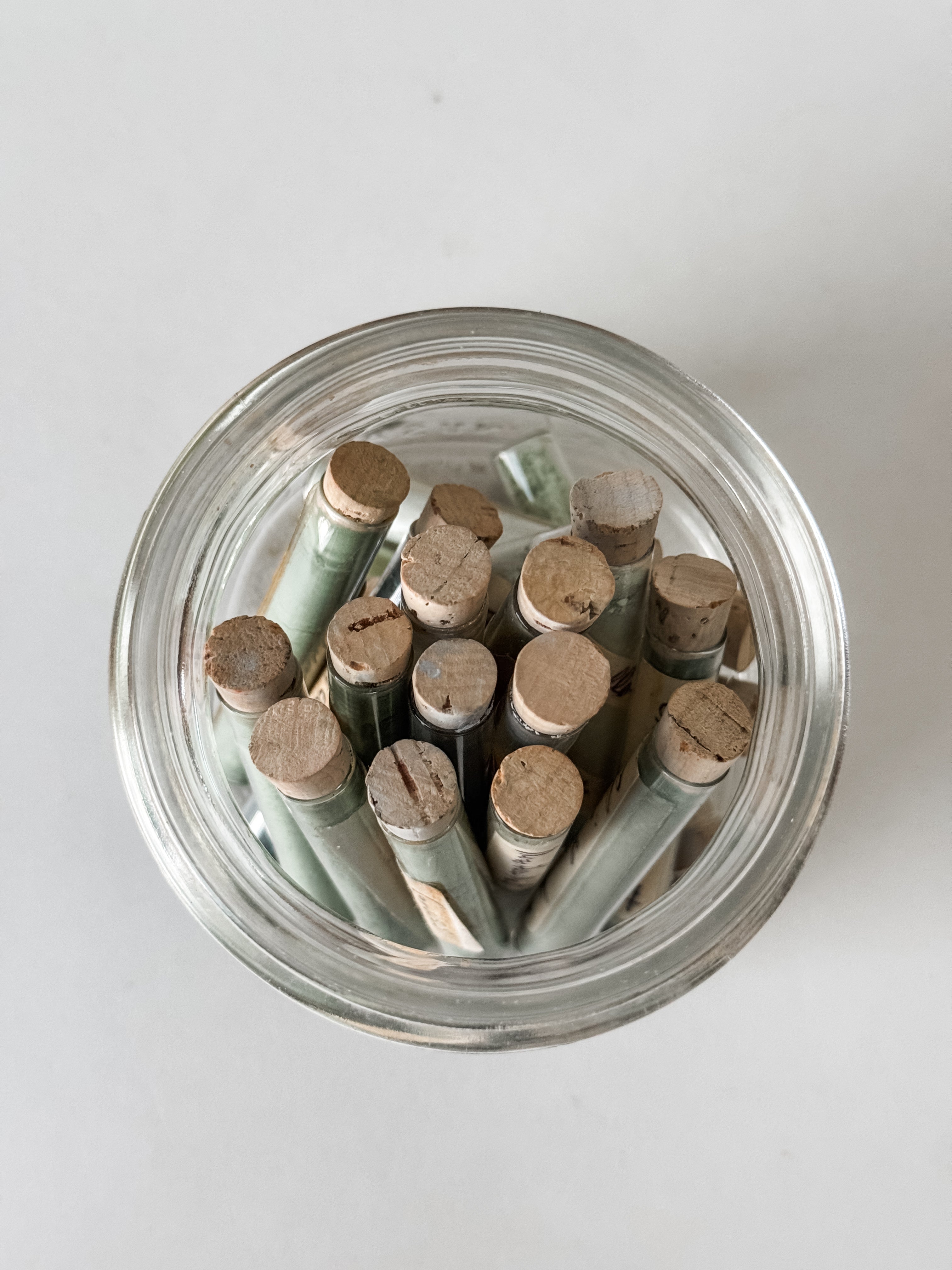 Glass Vials Of Vintage And Antique Paint Powder Pigments In A Vintage Jar With Zinc Lid