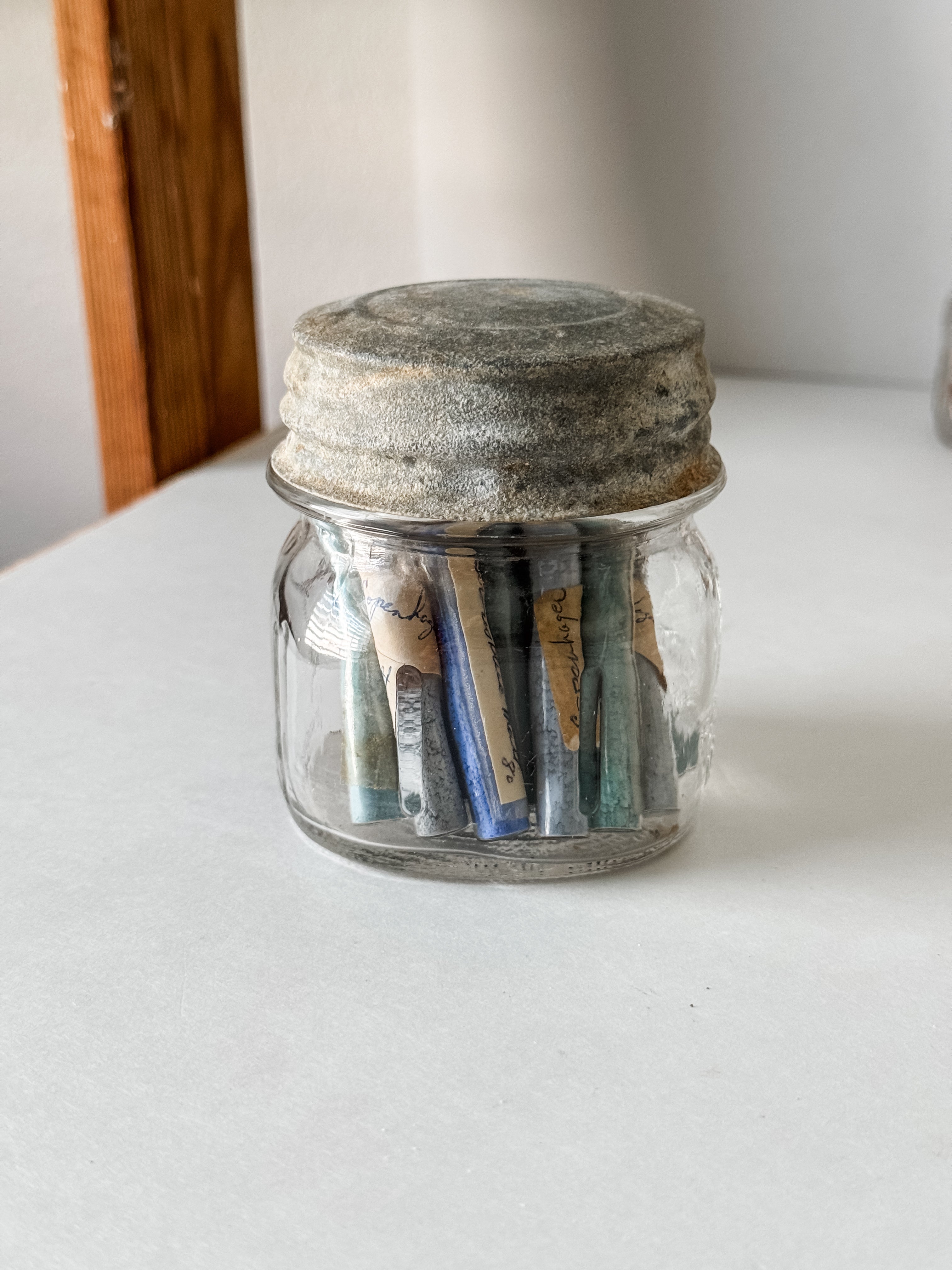 Glass Vials Of Vintage And Antique Paint Powder Pigments In A Vintage Jar With Zinc Lid