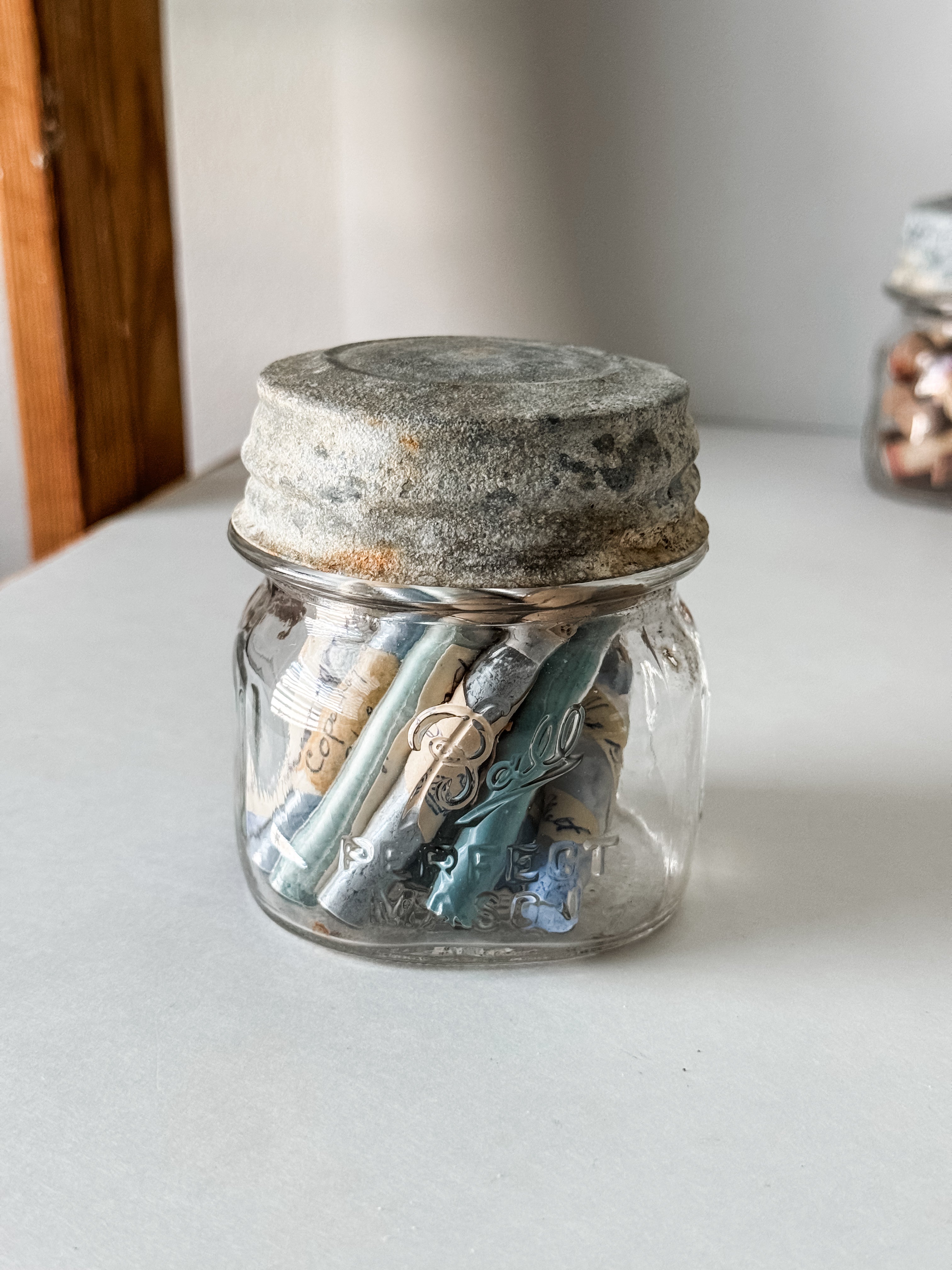 Glass Vials Of Vintage And Antique Paint Powder Pigments In A Vintage Jar With Zinc Lid