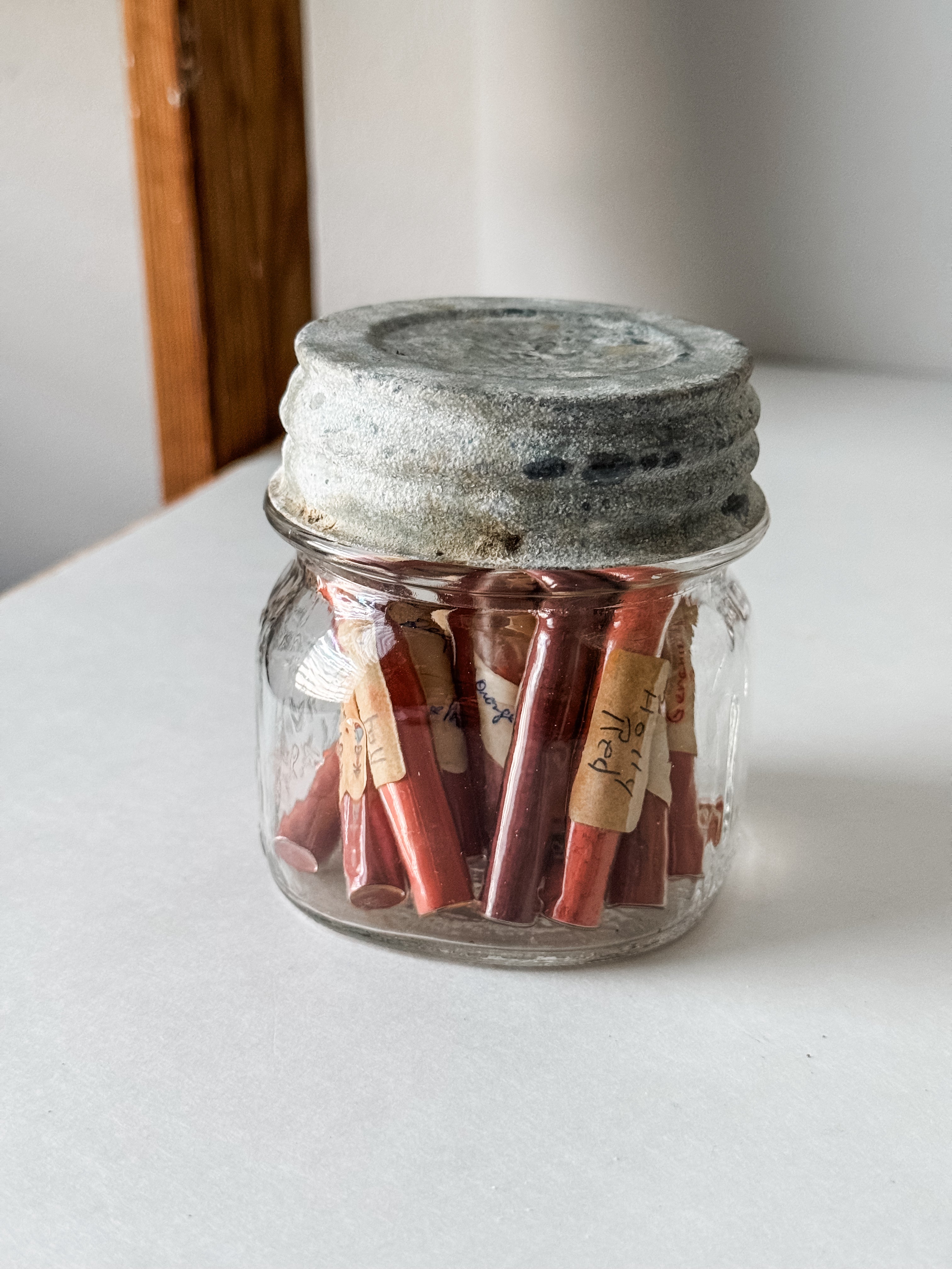 Glass Vials Of Vintage And Antique Paint Powder Pigments In A Vintage Jar With Zinc Lid