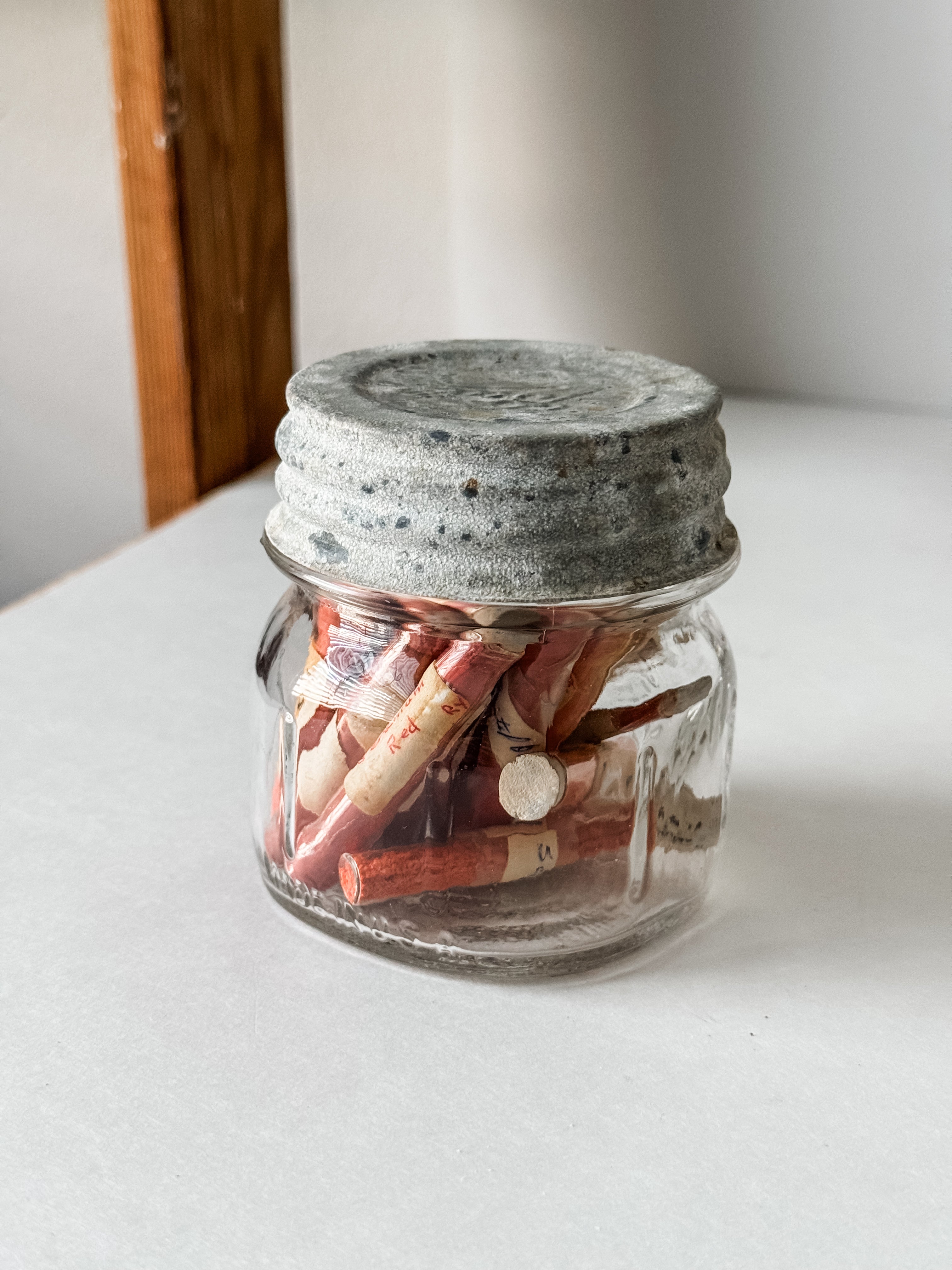 Glass Vials Of Vintage And Antique Paint Powder Pigments In A Vintage Jar With Zinc Lid