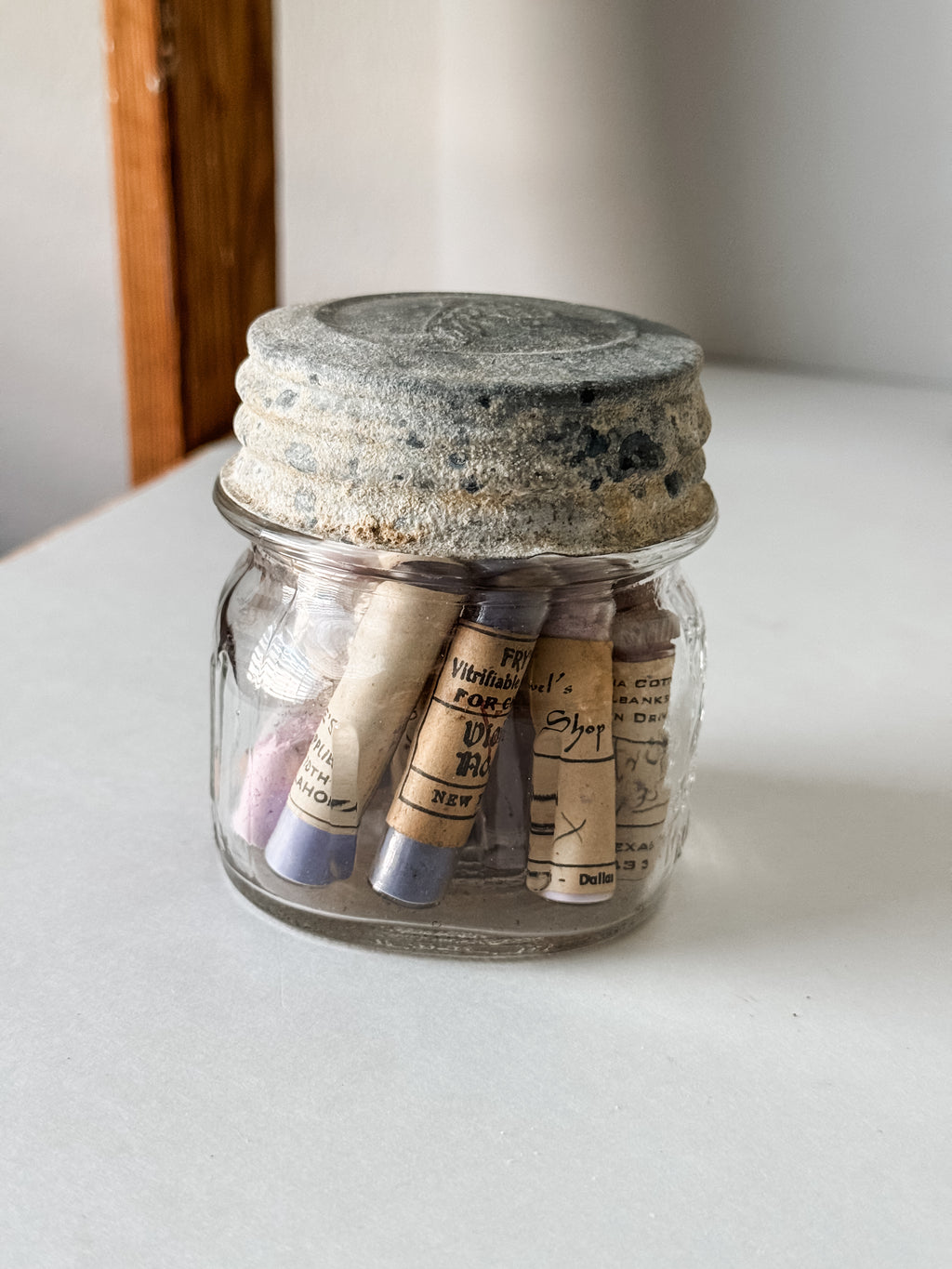 Glass Vials Of Vintage And Antique Paint Powder Pigments In A Vintage Jar With Zinc Lid