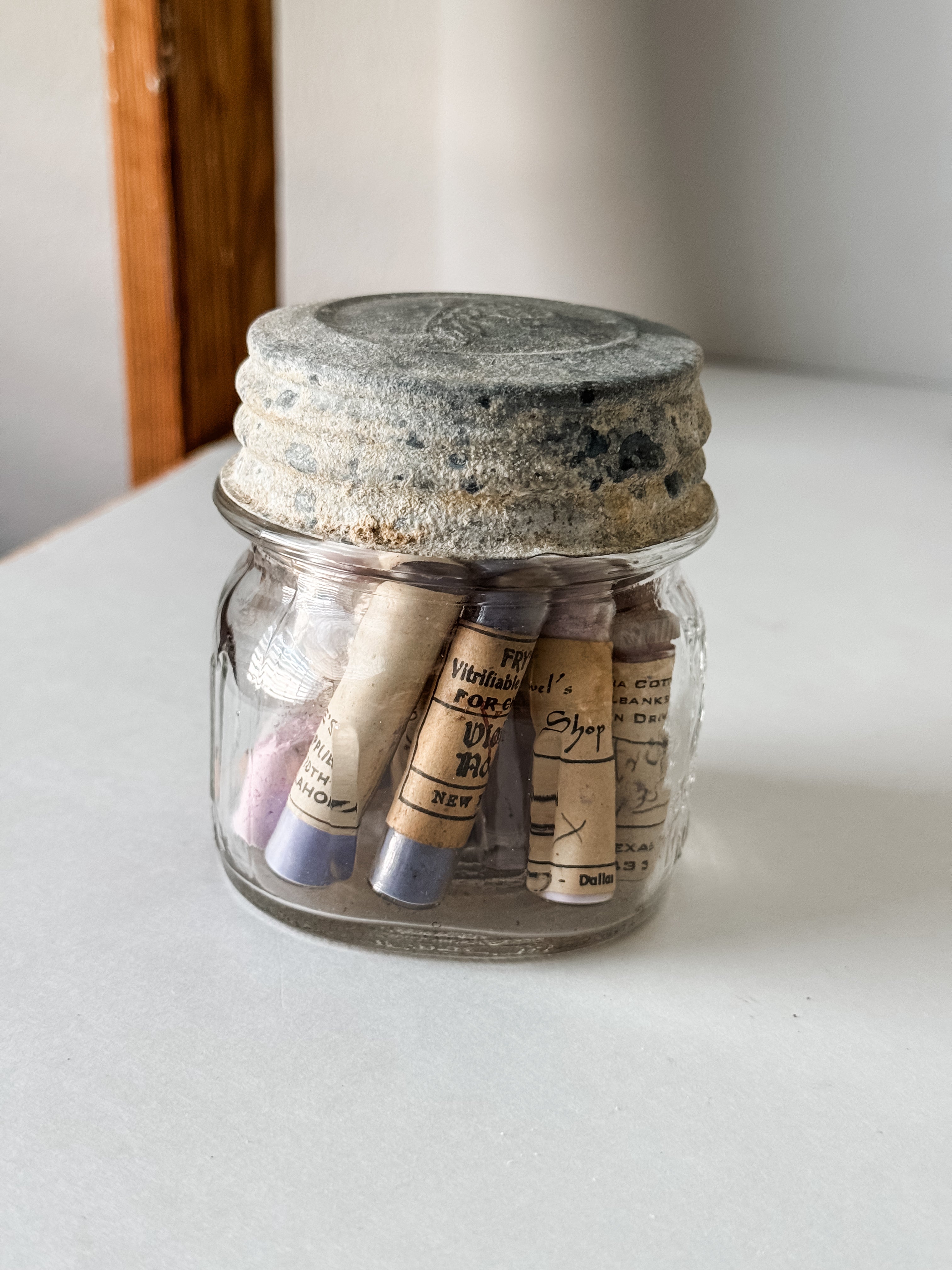 Glass Vials Of Vintage And Antique Paint Powder Pigments In A Vintage Jar With Zinc Lid