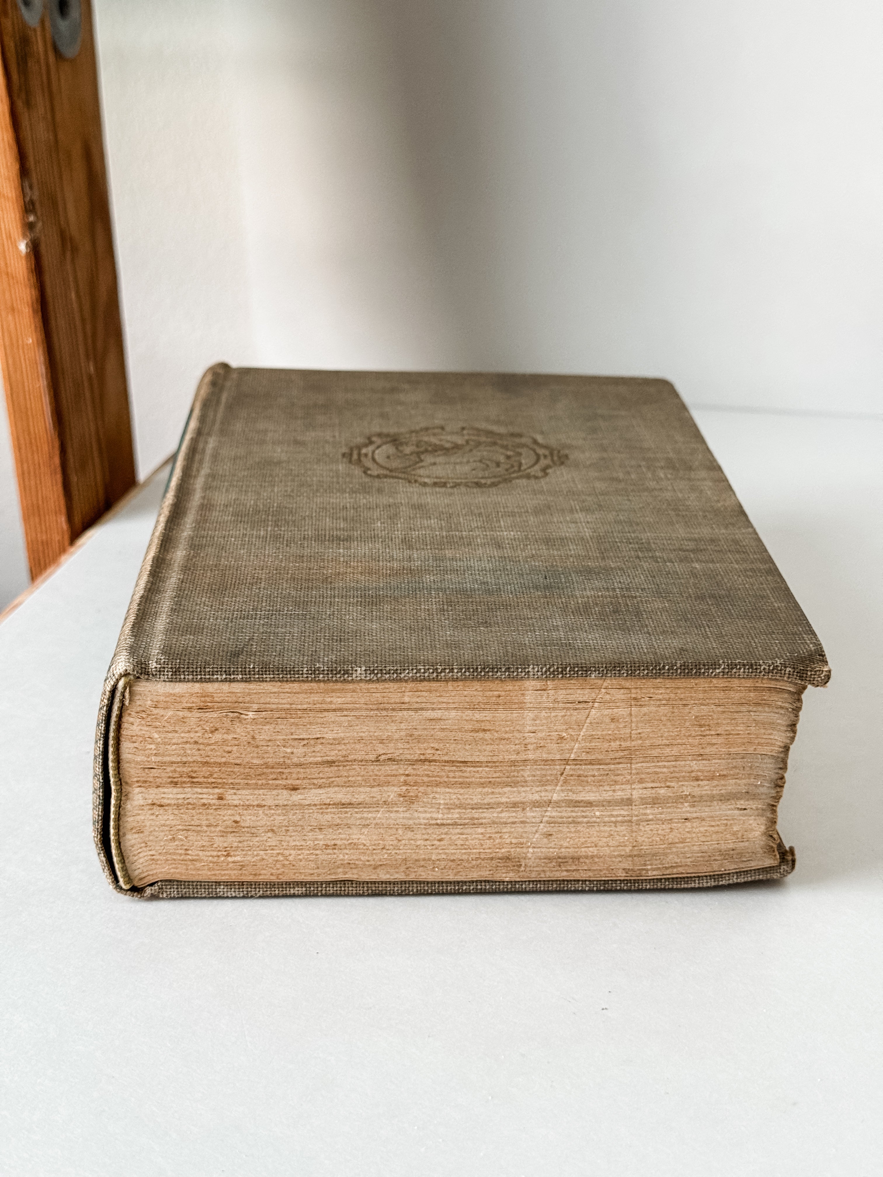 Vintage Neutral Book With Green Graphics On The Spine