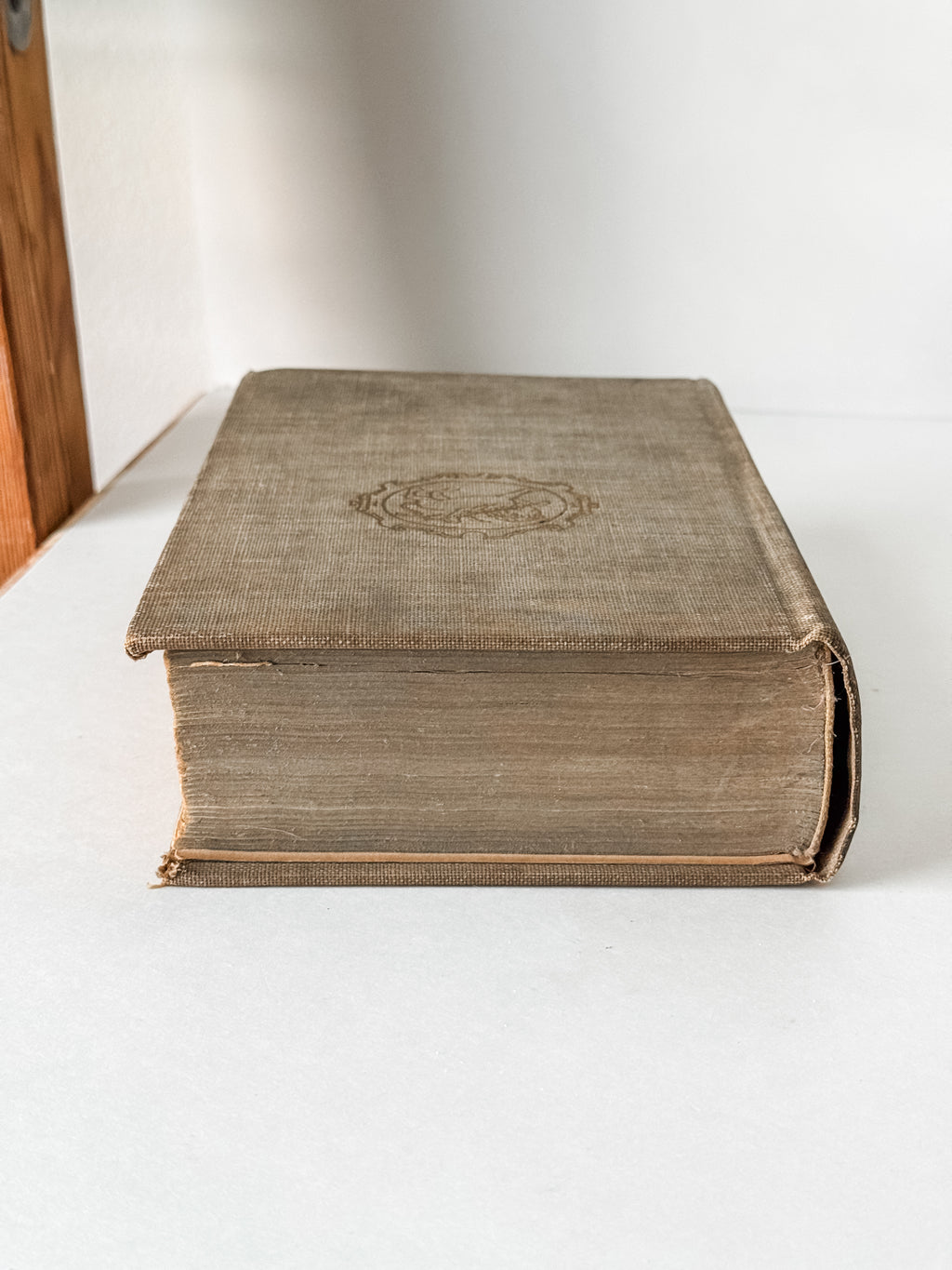 Vintage Neutral Book With Green Graphics On The Spine