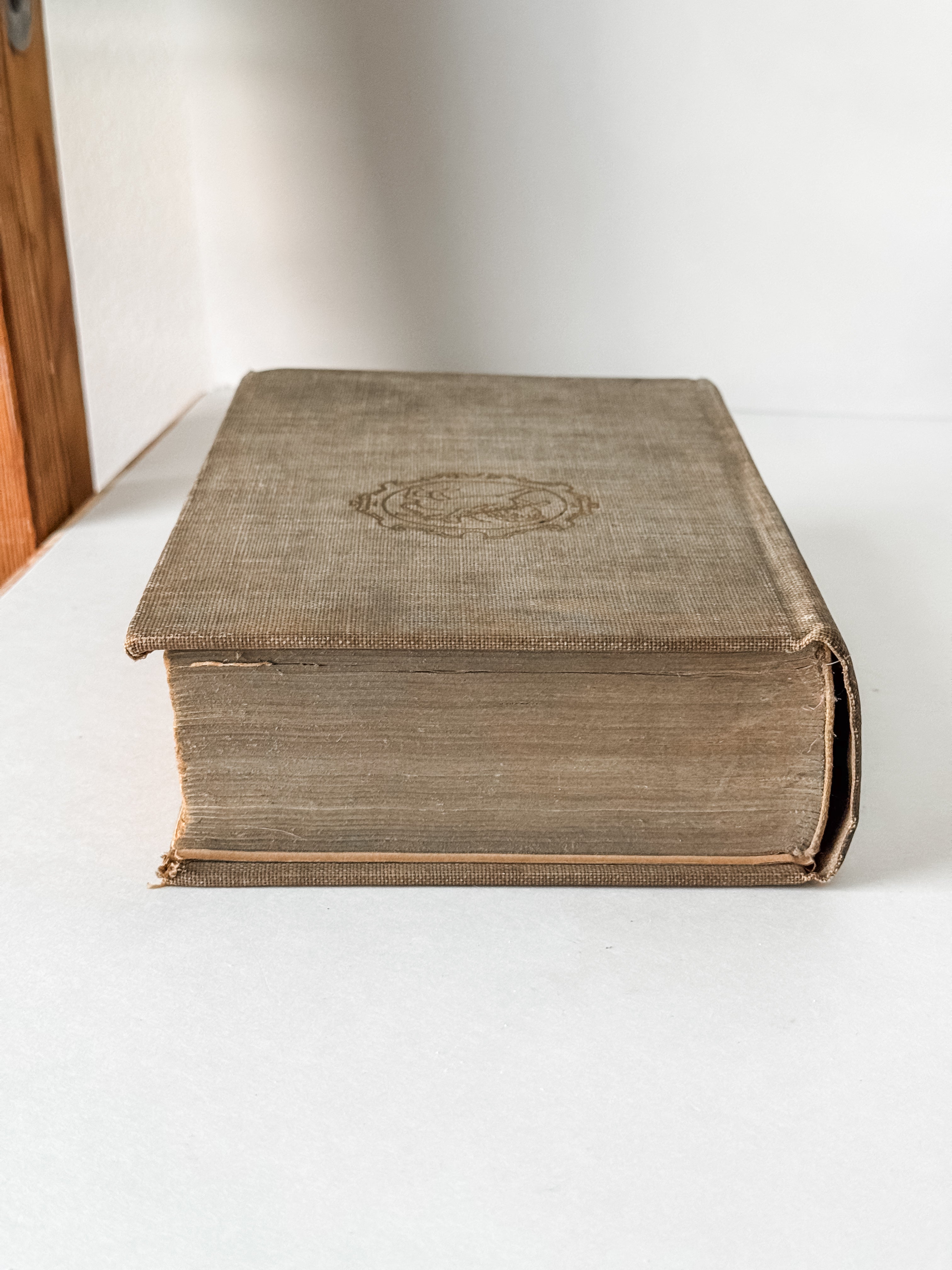 Vintage Neutral Book With Green Graphics On The Spine