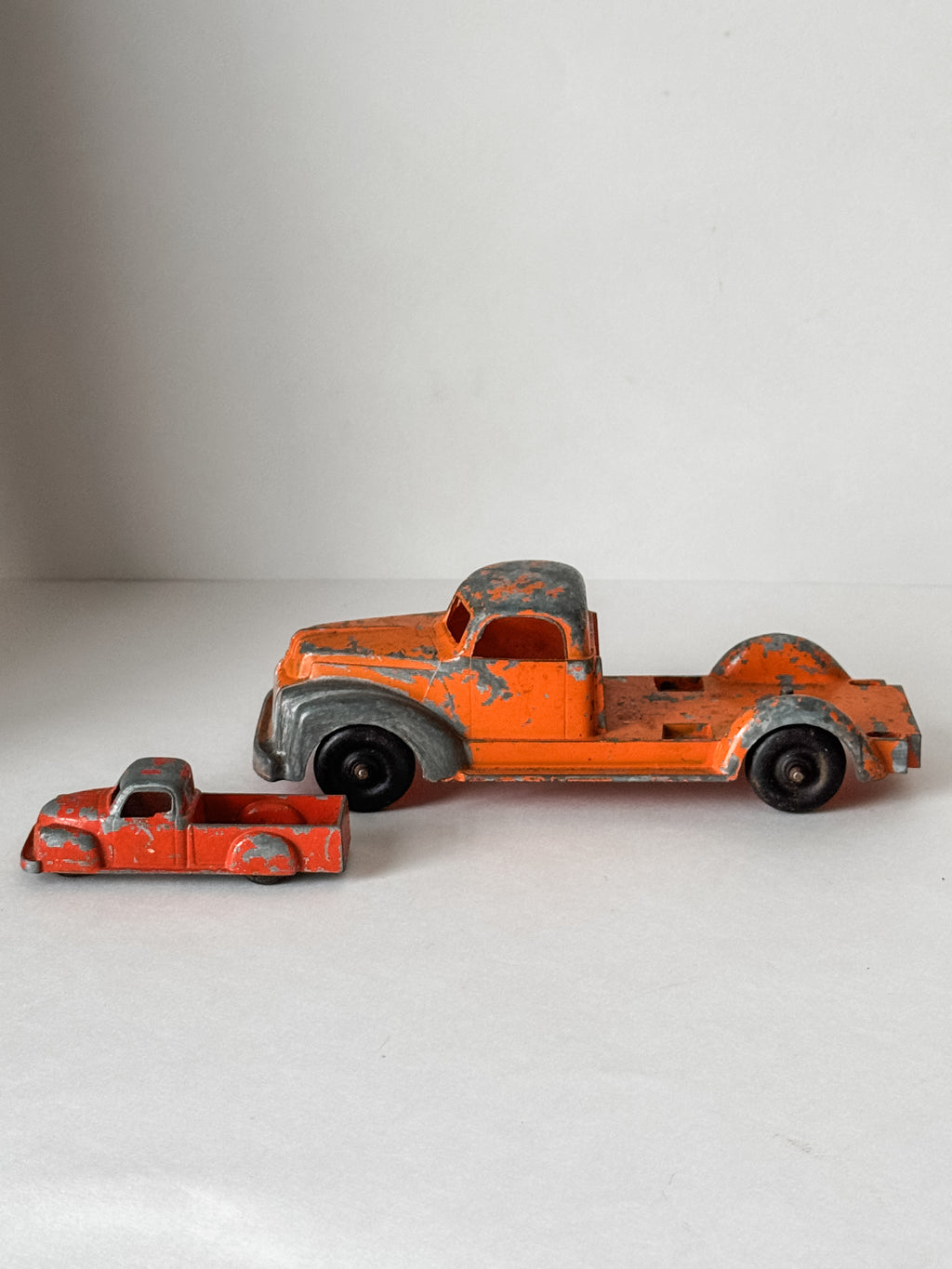 Pair Of Vintage Metal Chippy Orange Toy Trucks