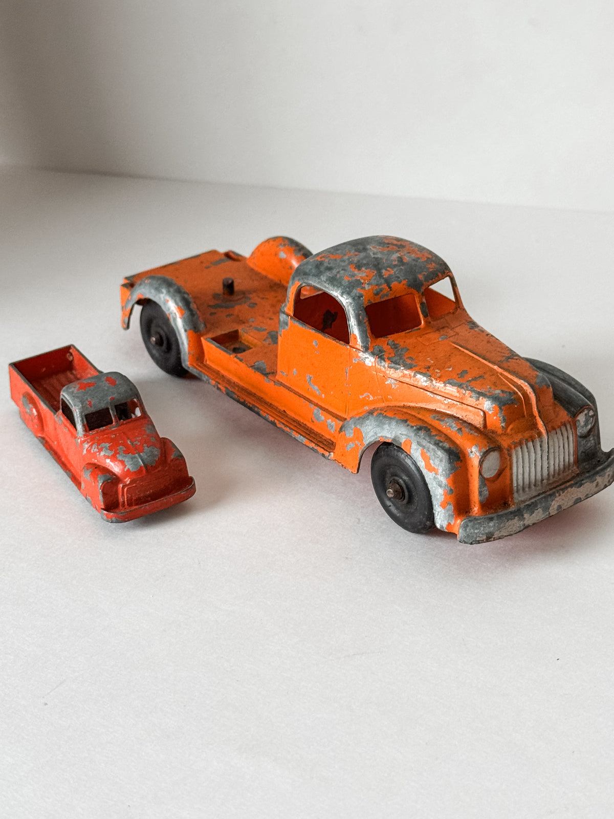 Pair Of Vintage Metal Chippy Orange Toy Trucks