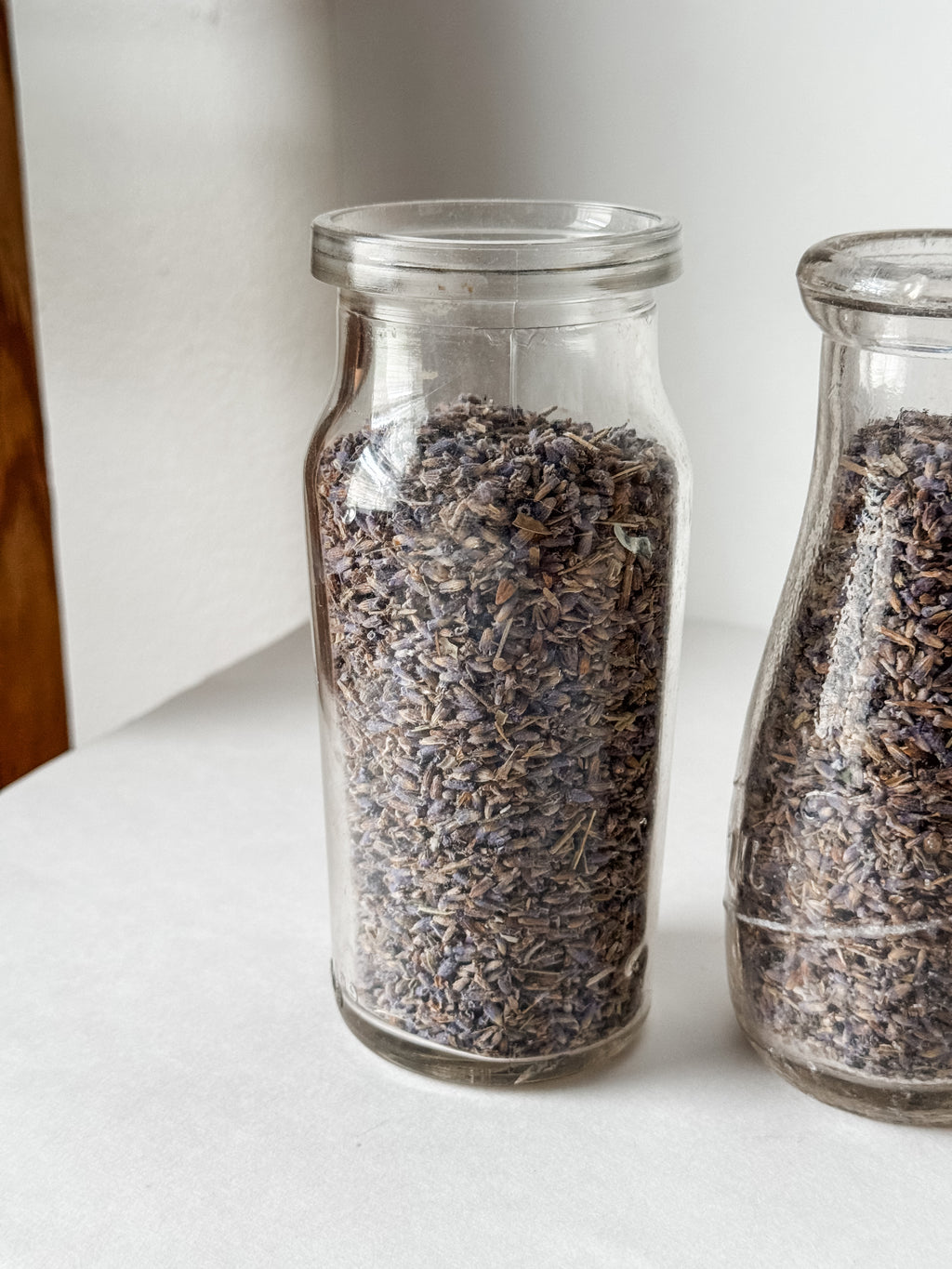 Pair Of Old Dairy Milk Bottles Filled With Loose Lavender