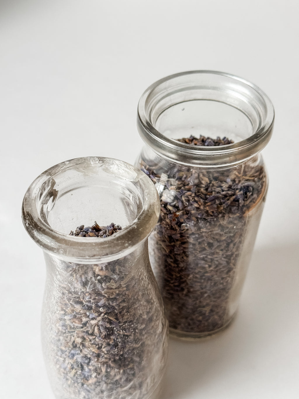 Pair Of Old Dairy Milk Bottles Filled With Loose Lavender