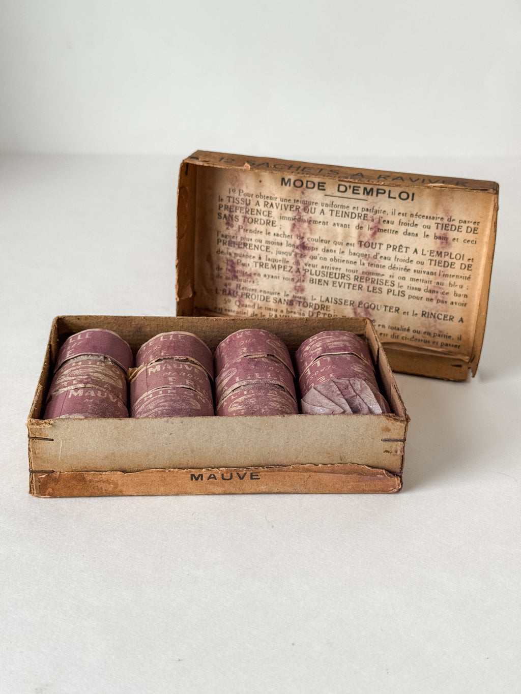 Antique French Cardboard Box Of Mauve Colored Fabric Dyes