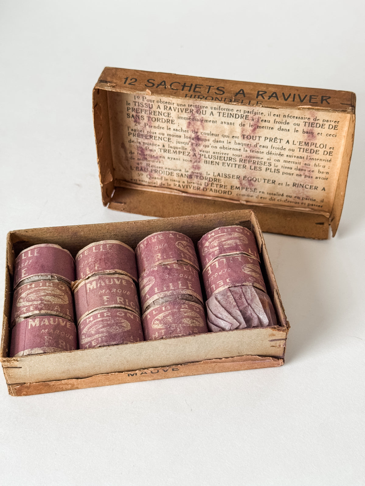 Antique French Cardboard Box Of Mauve Colored Fabric Dyes