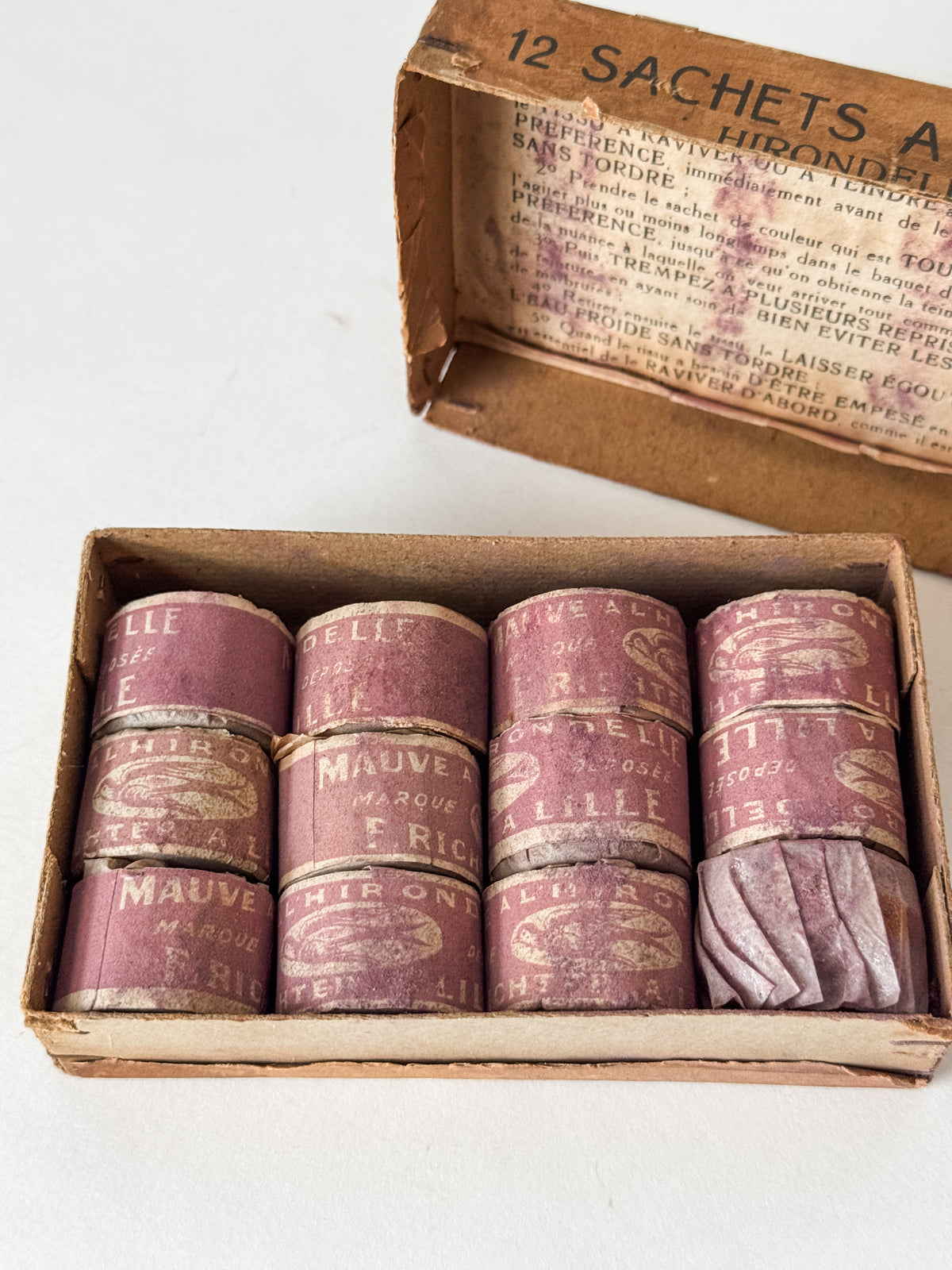 Antique French Cardboard Box Of Mauve Colored Fabric Dyes