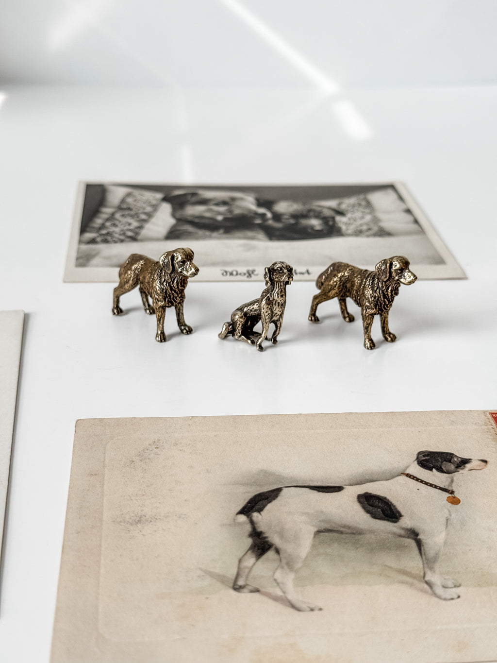 Collection Of Dog Themed Vintage And Antique Postcards And Brass Figures