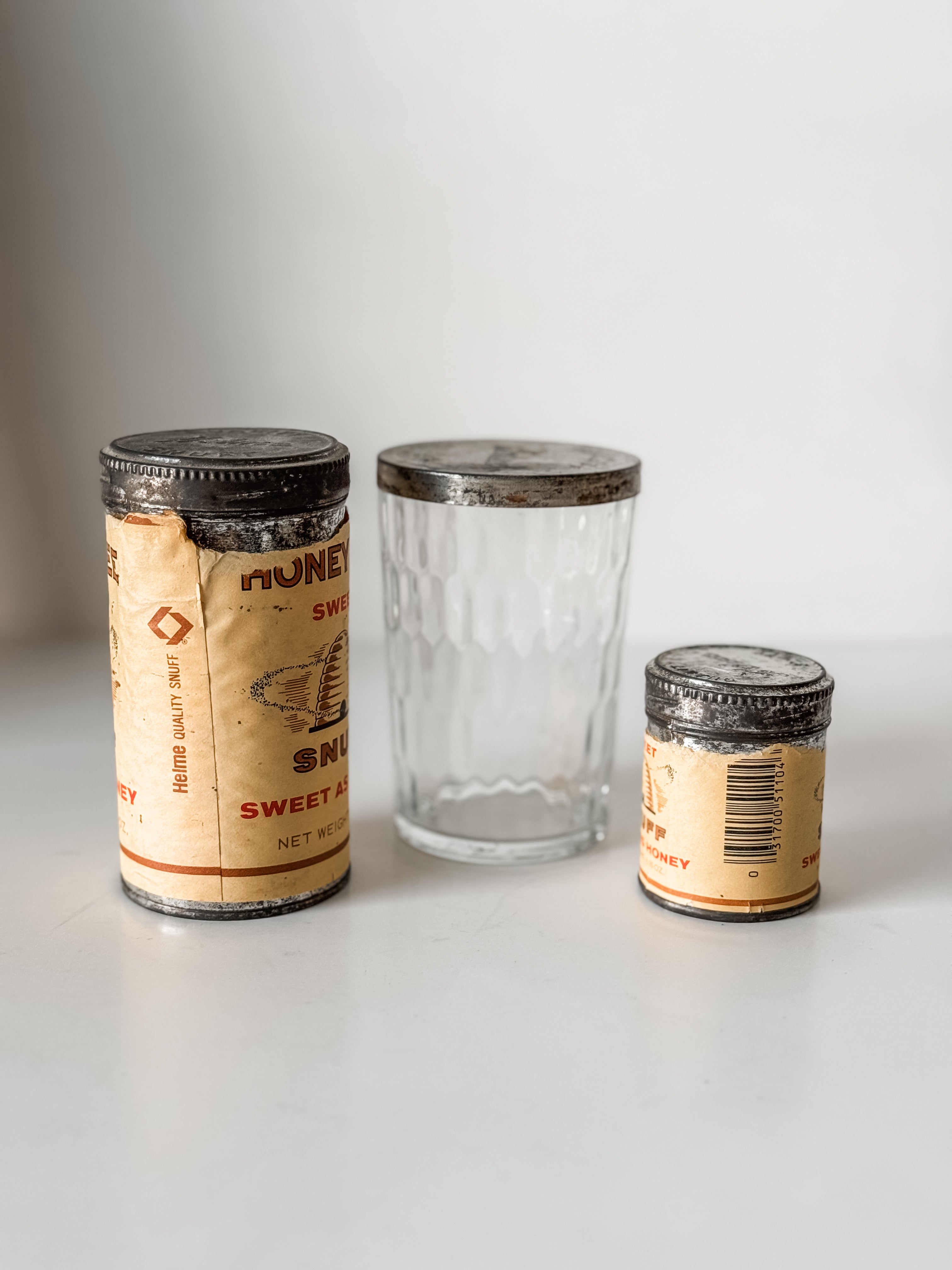 Collection Of Honey Bee Snuff Containers With Graphics
