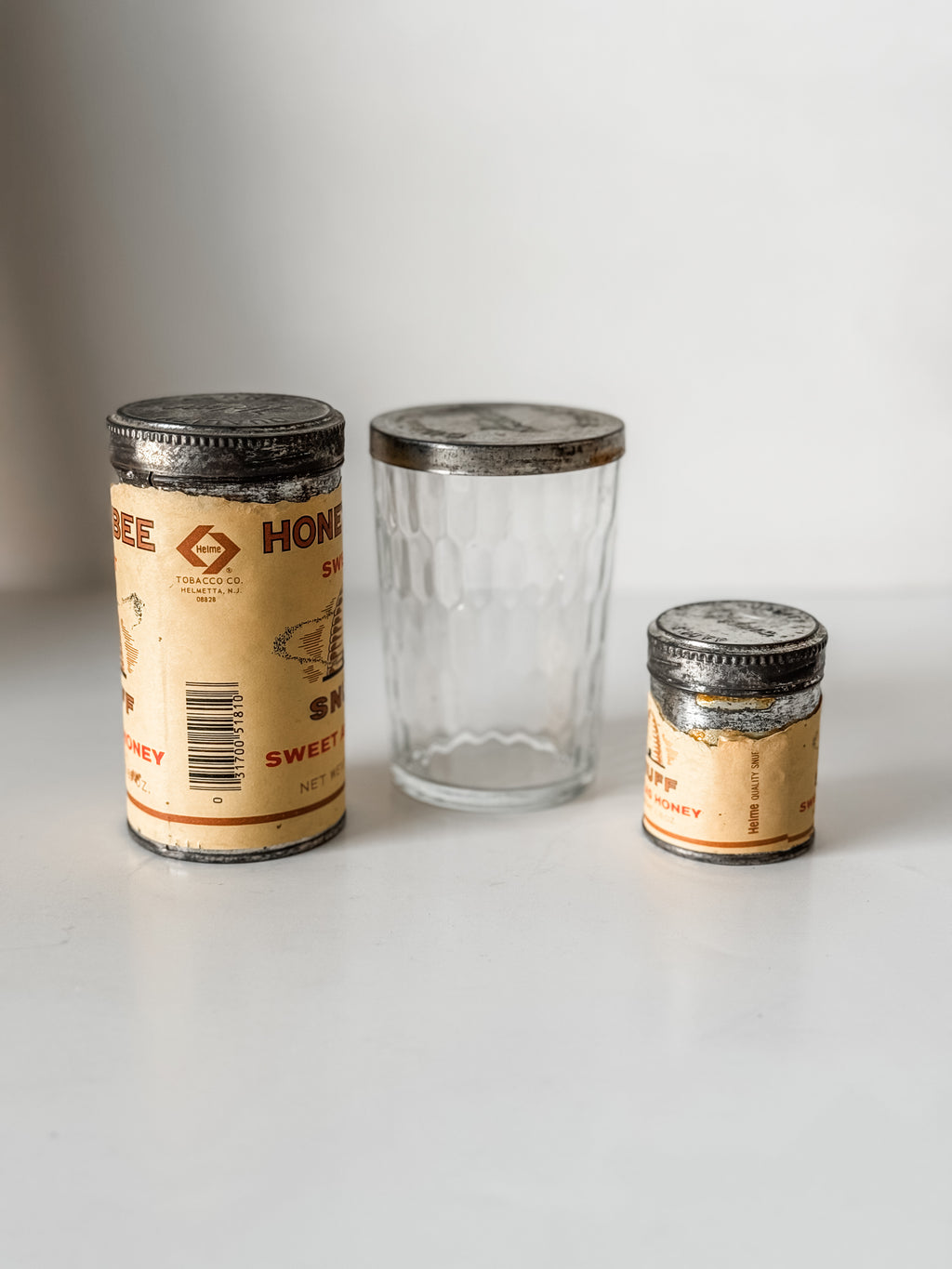 Collection Of Honey Bee Snuff Containers With Graphics