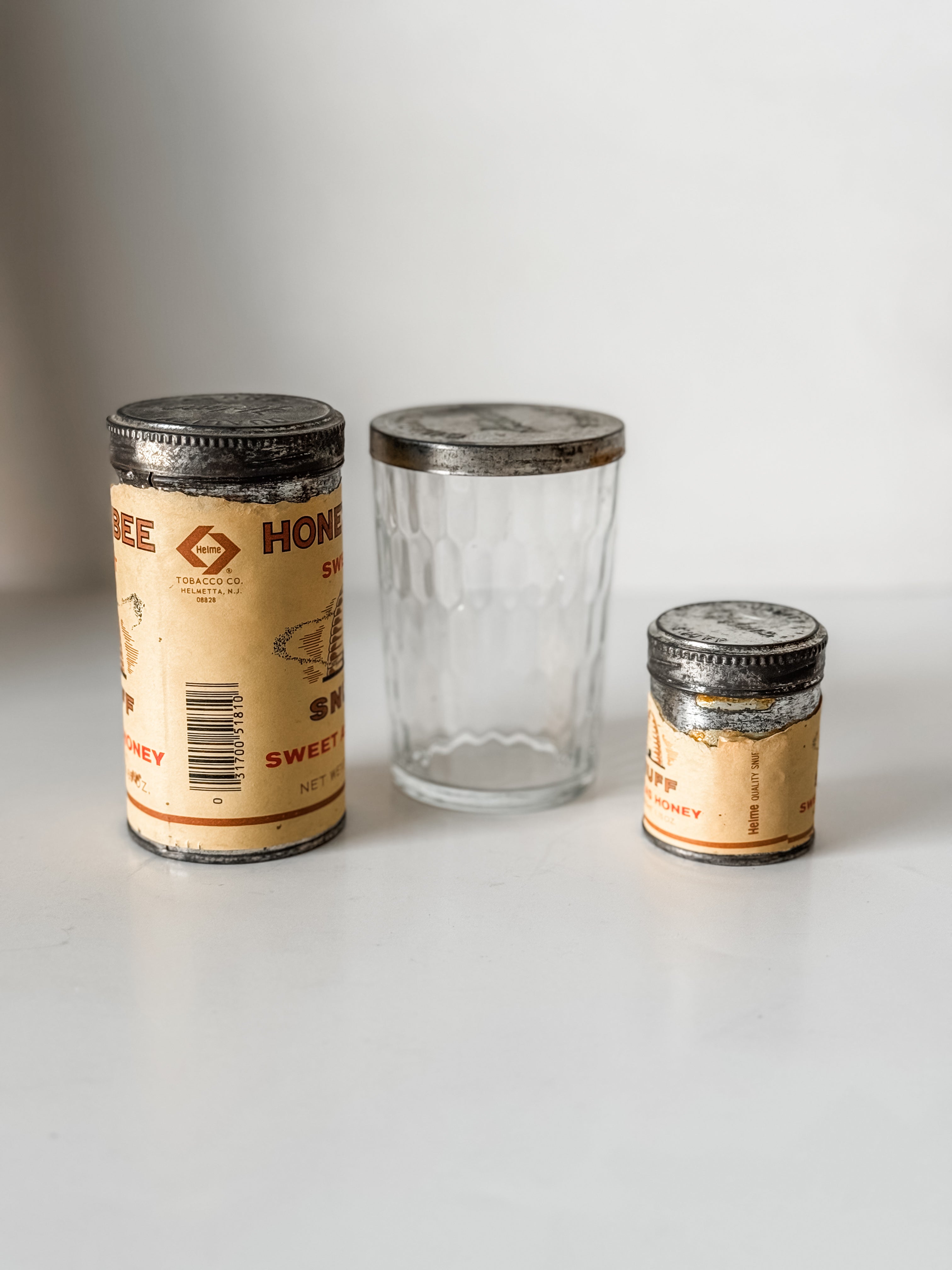 Collection Of Honey Bee Snuff Containers With Graphics