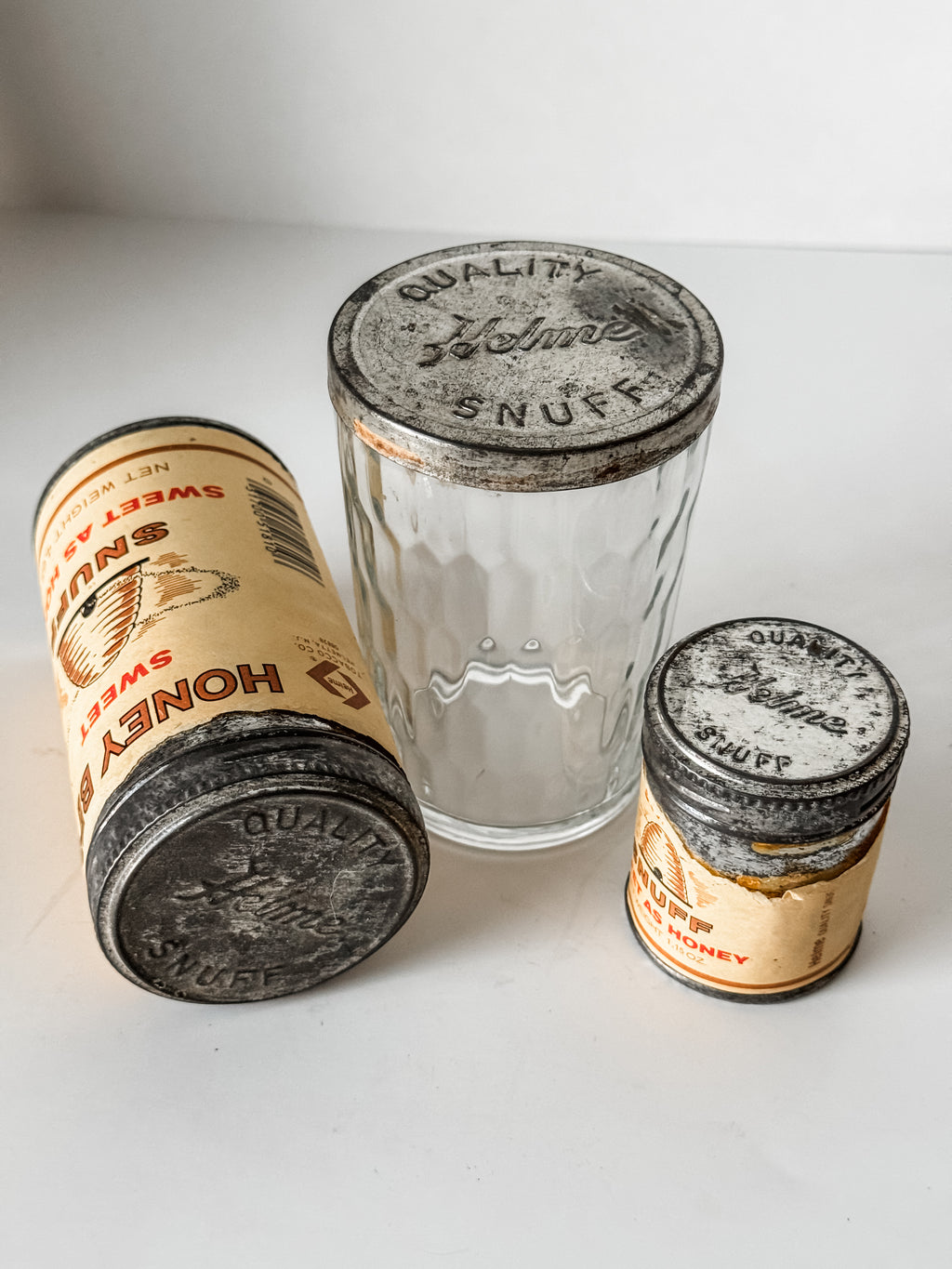 Collection Of Honey Bee Snuff Containers With Graphics