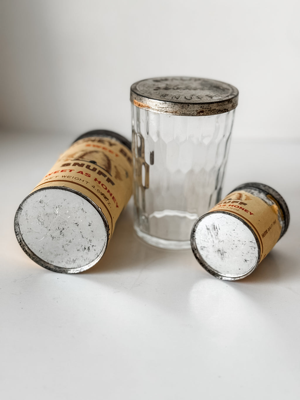 Collection Of Honey Bee Snuff Containers With Graphics