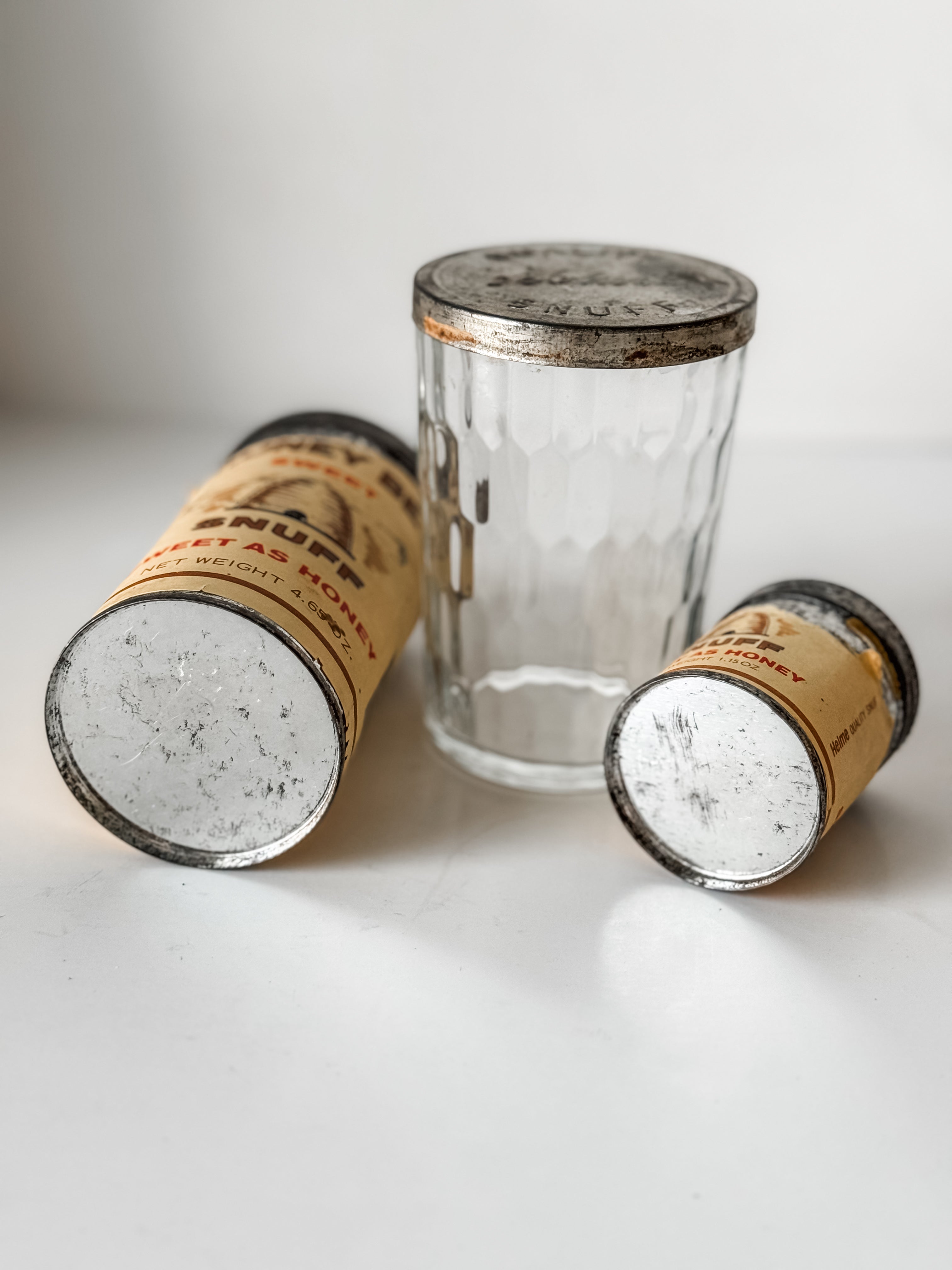 Collection Of Honey Bee Snuff Containers With Graphics