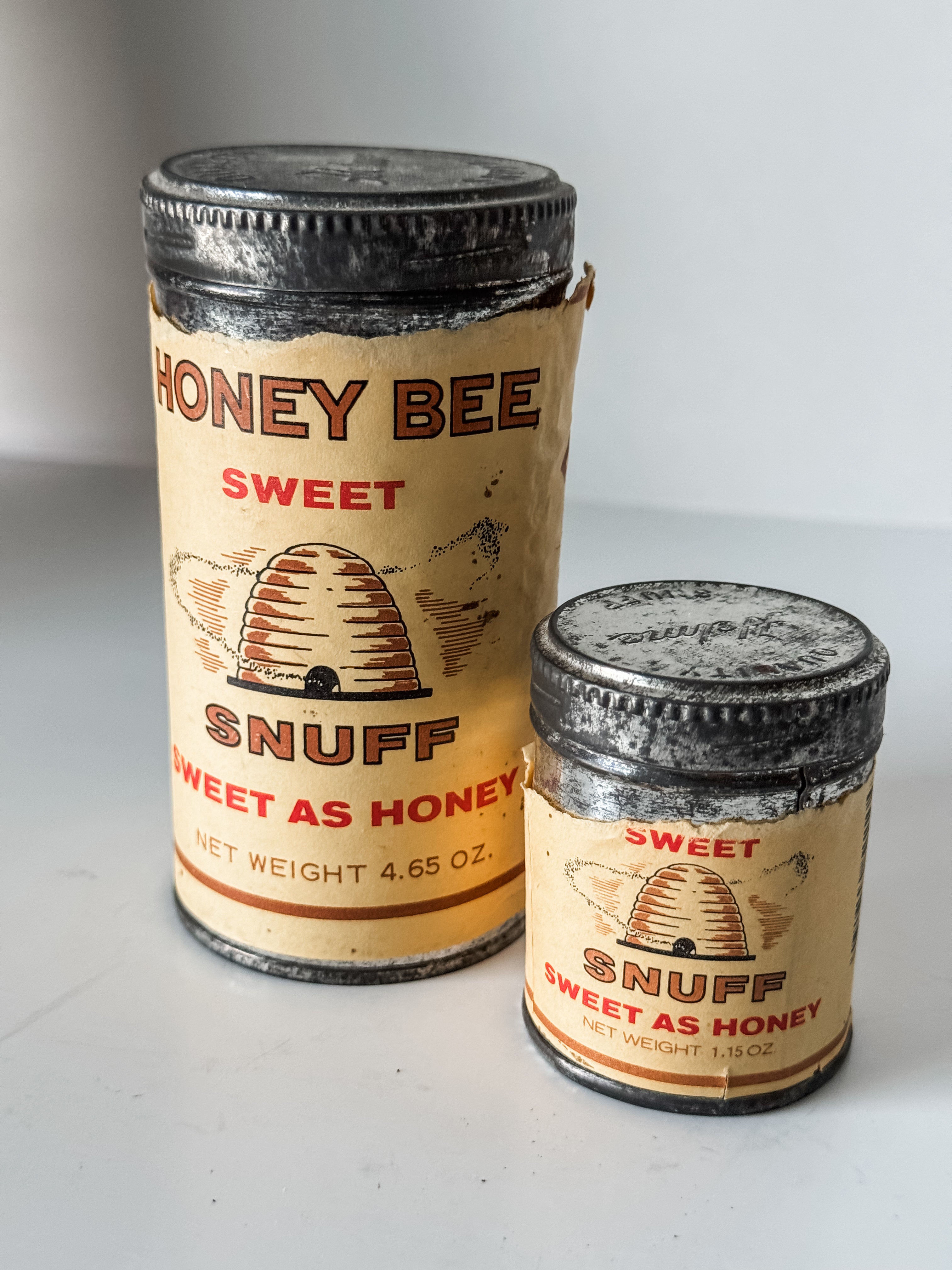 Collection Of Honey Bee Snuff Containers With Graphics