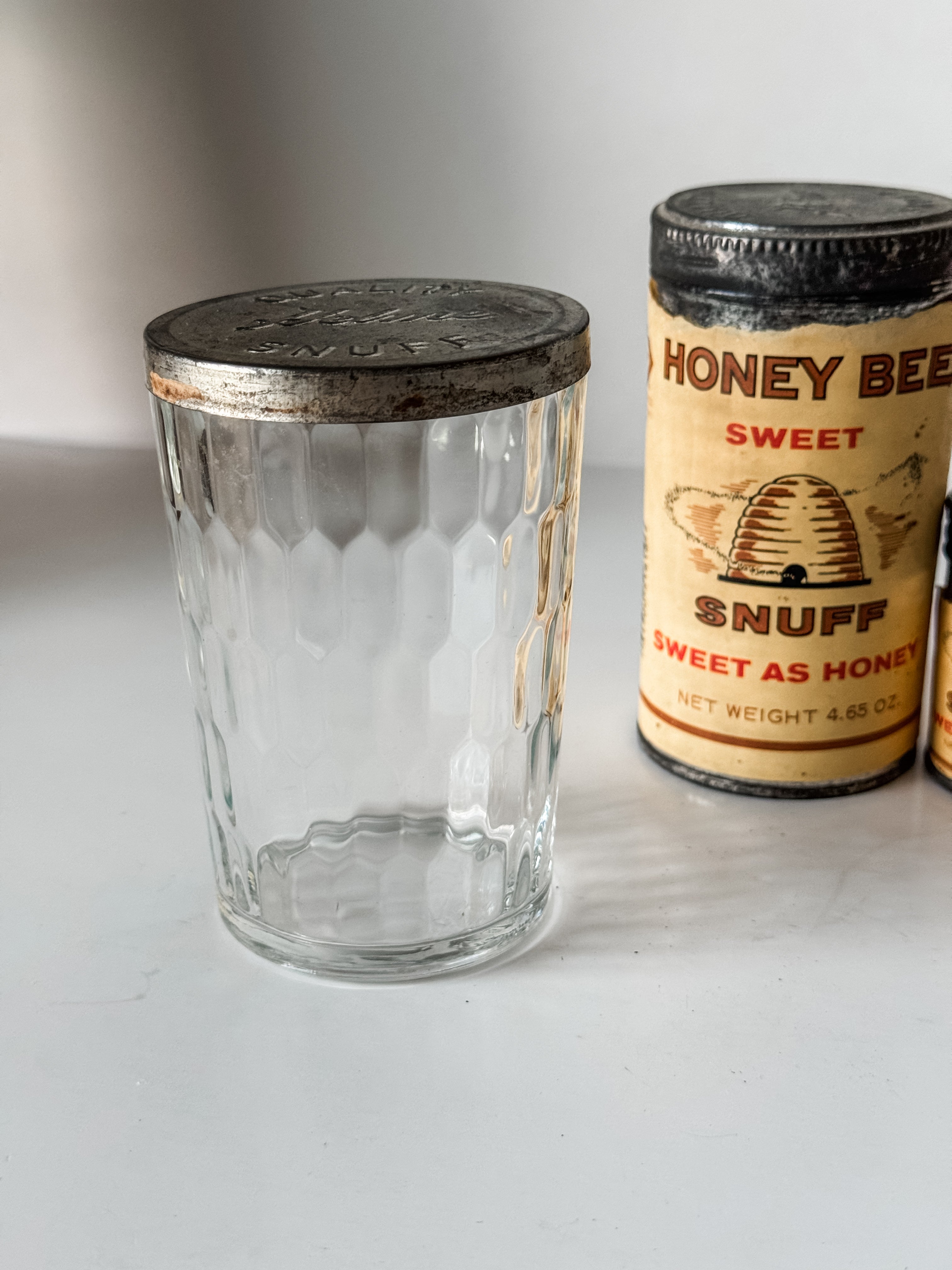 Collection Of Honey Bee Snuff Containers With Graphics